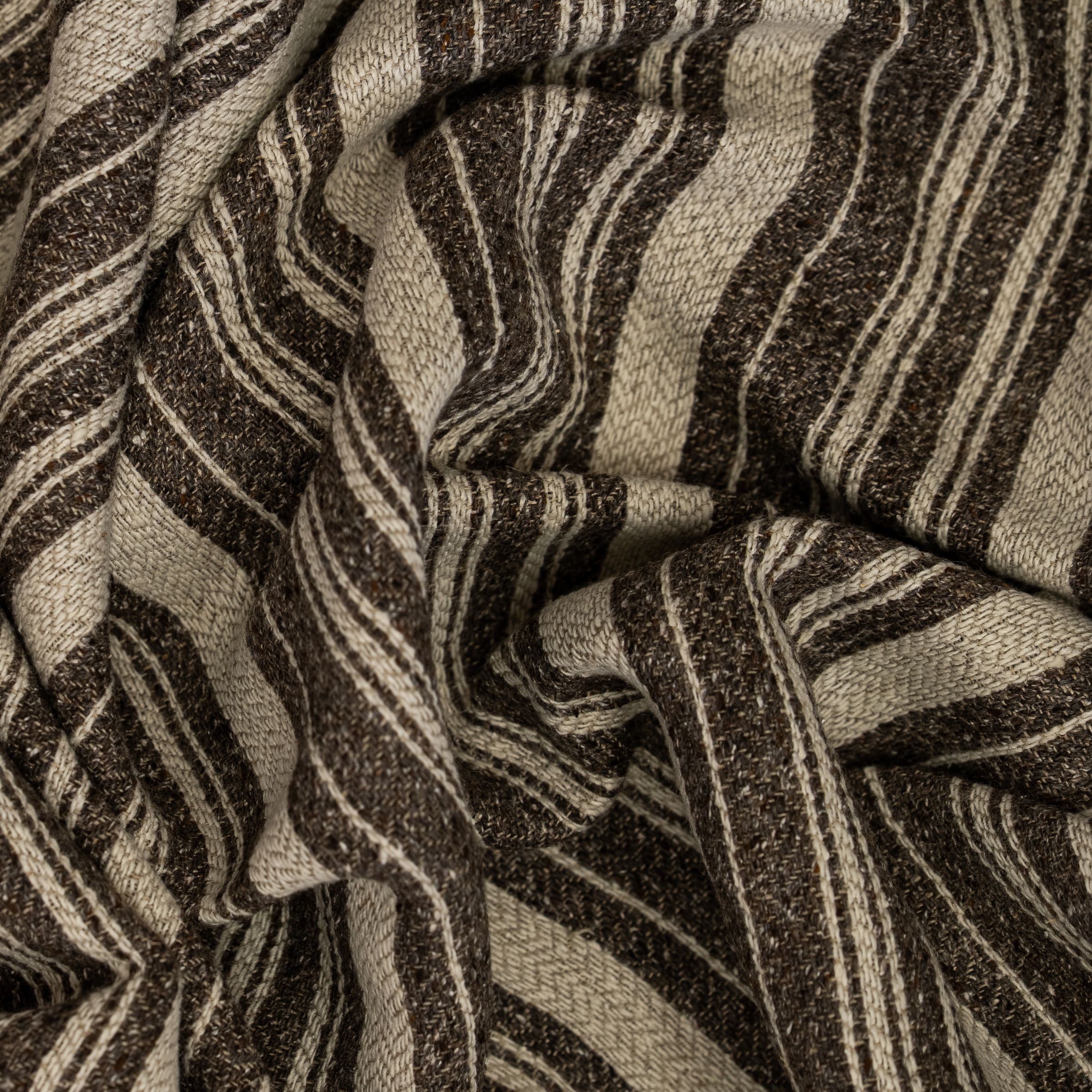 Textured fabric with vertical brown and beige stripes with scrunched folds