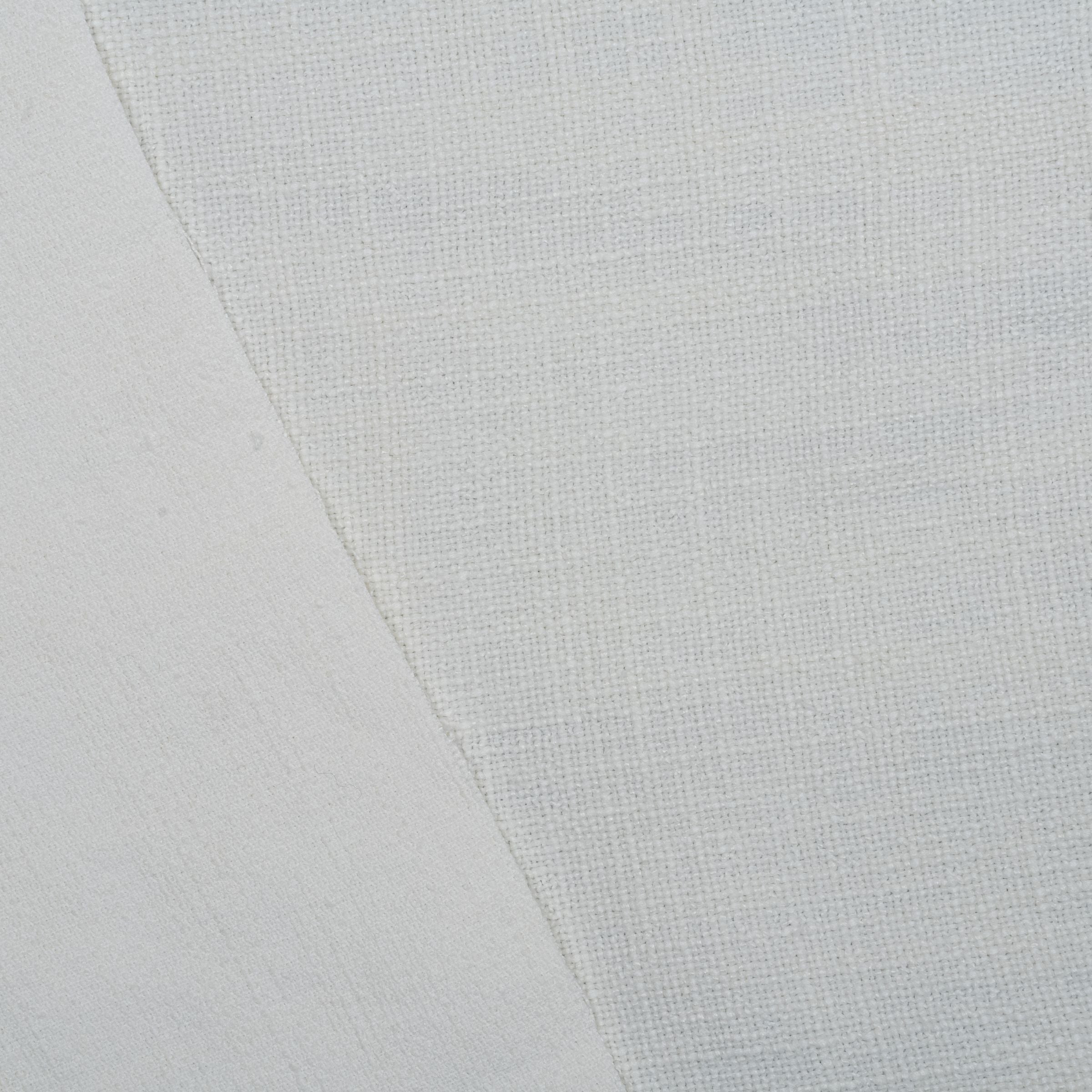 Close-up of white fabric and upholstery backing