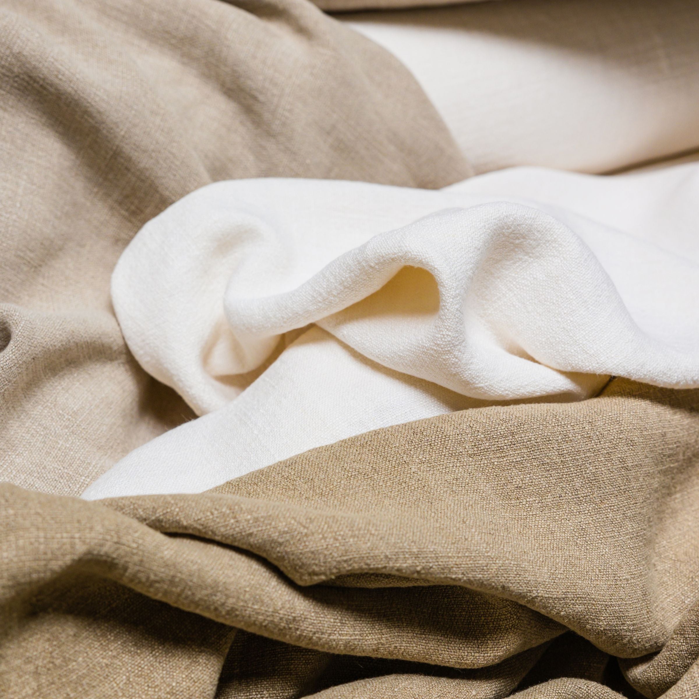 Close-up of beige, gray, and white fabric textures