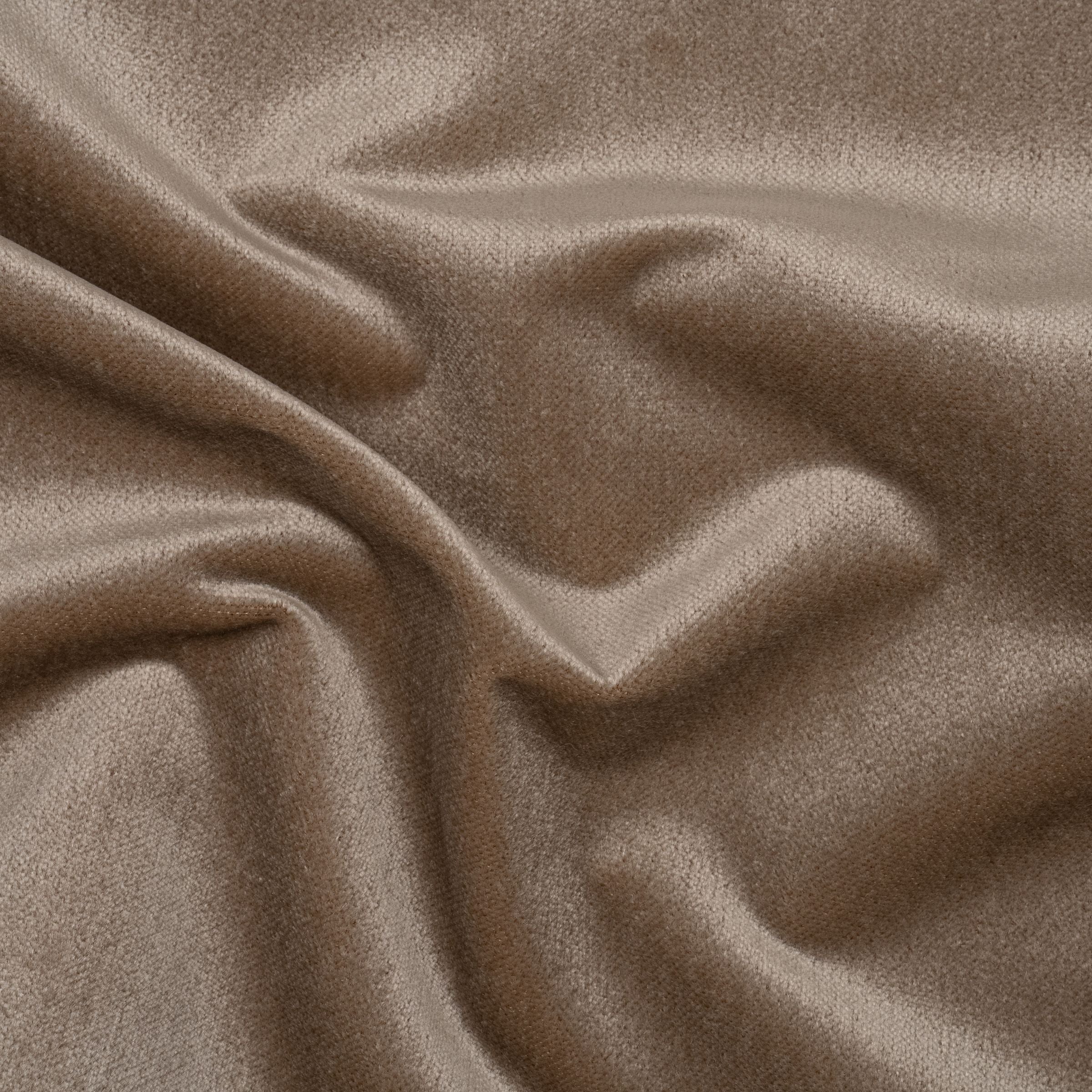 Solid velvet brown color fabric with wavy folds