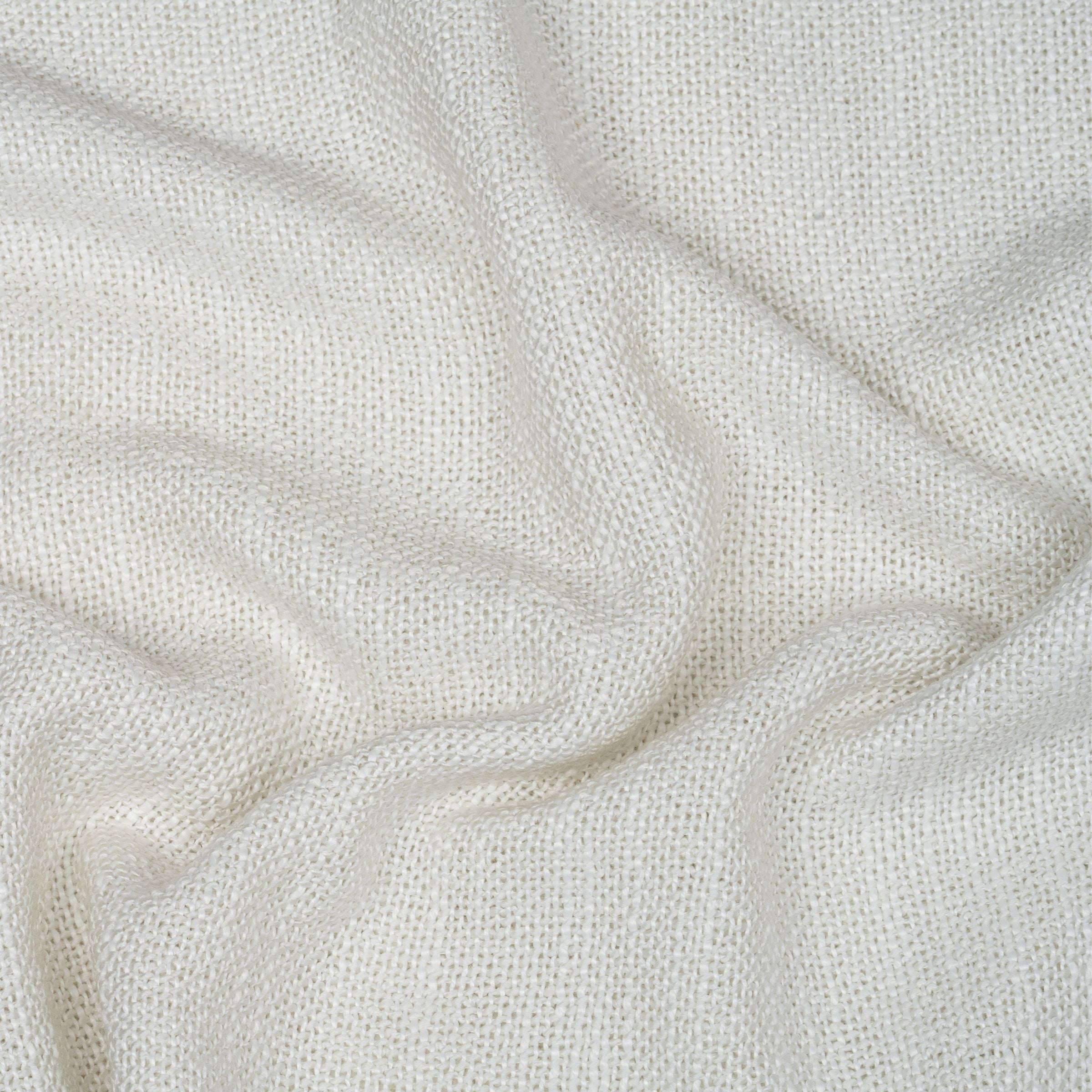 Close-up of white fabric with subtle wavy texture