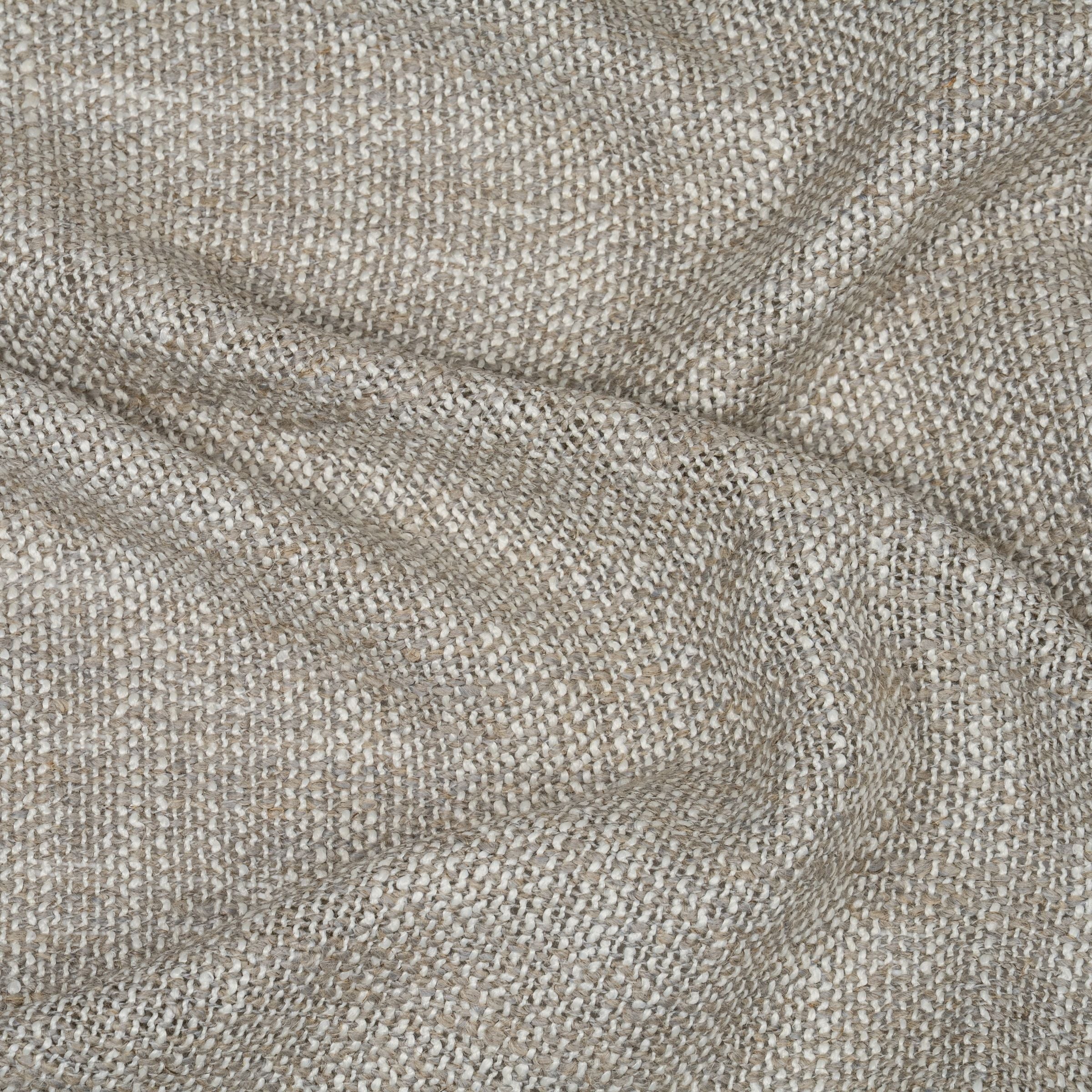 Close-up of textured beige fabric with a subtle wavy fold