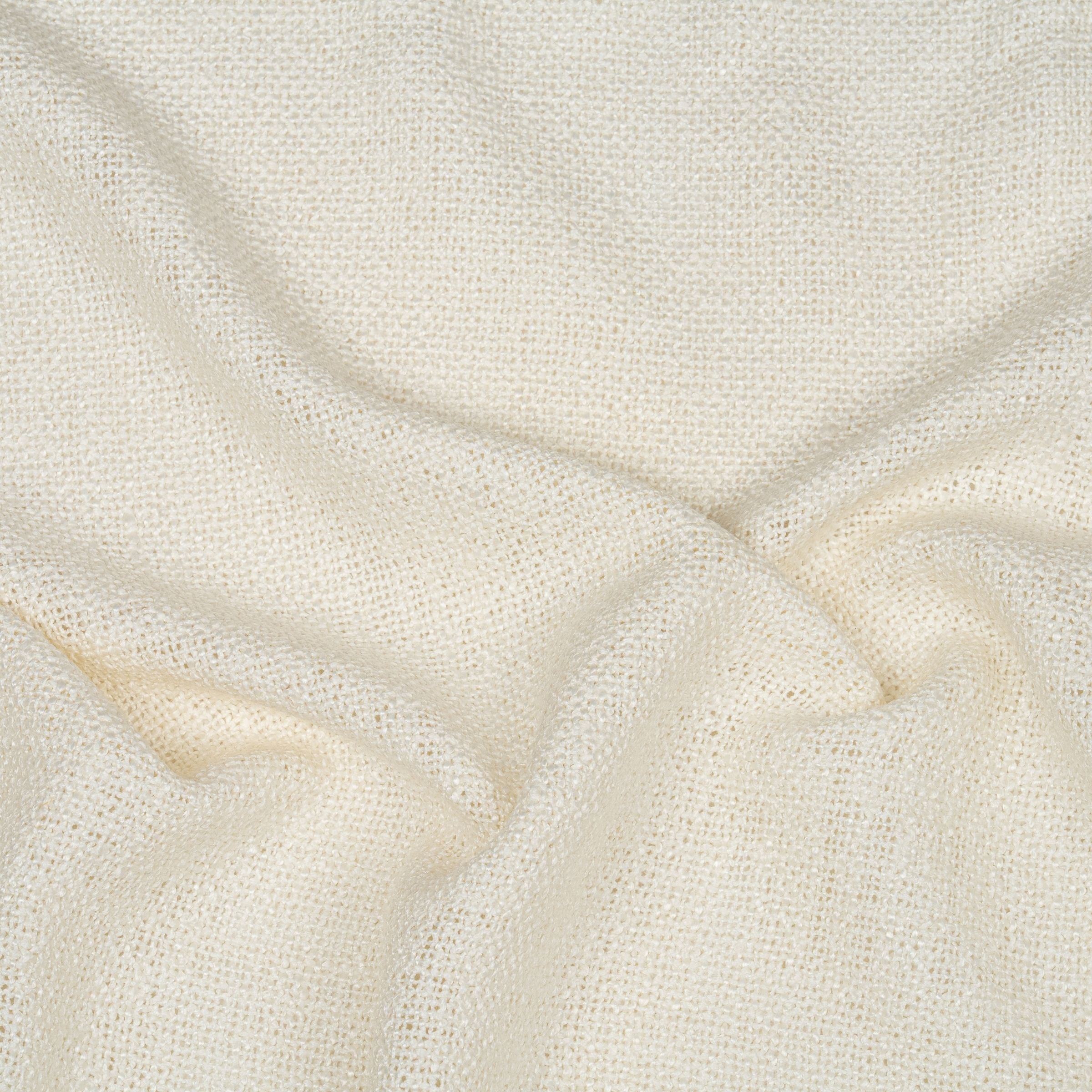 Close-up of textured off-white fabric with subtle folds