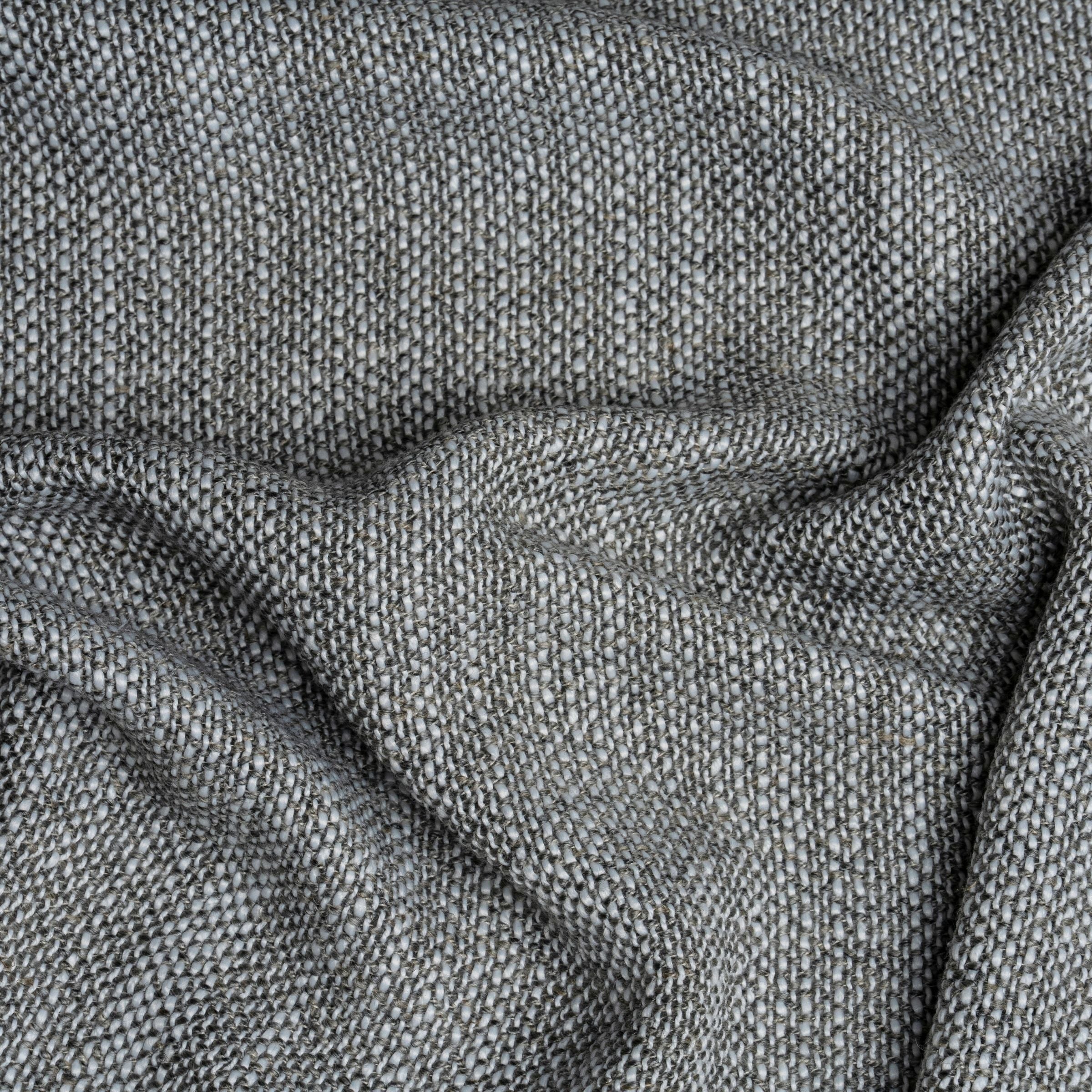 Close up gray and white textured fabric with wavy folds