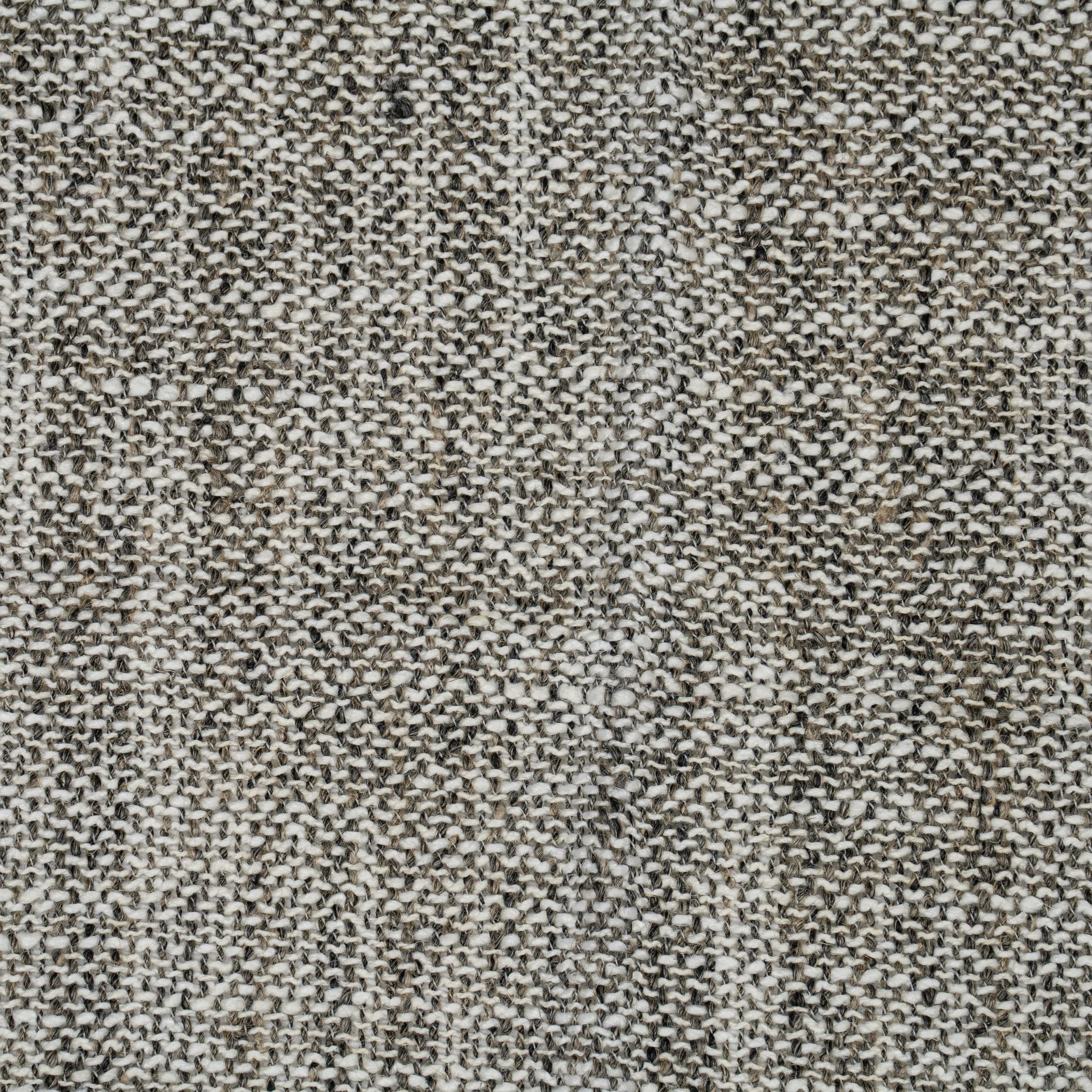 Textured fabric pattern with neutral white and beige tones