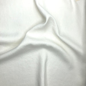 Close-up of scrunched white fabric with subtle texture