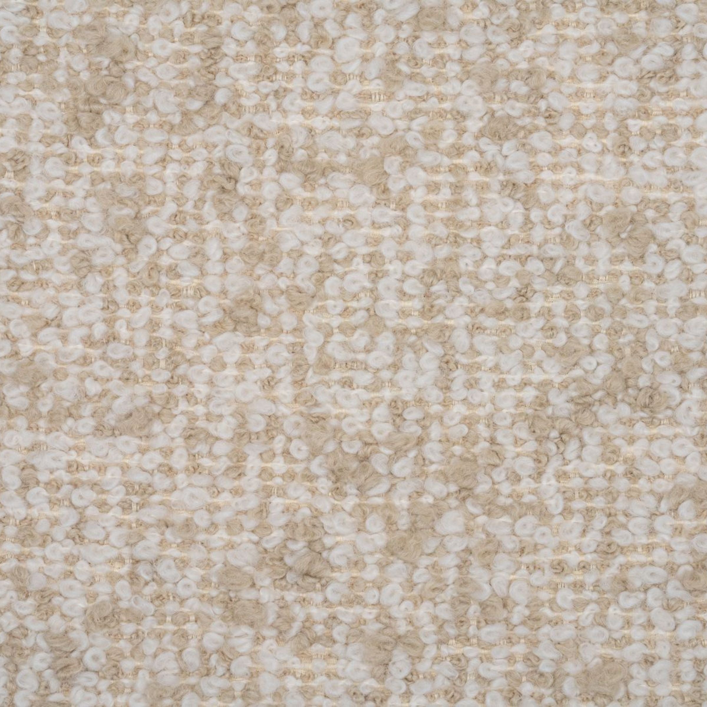 Close-up of a beige and white boucle textured fabric 