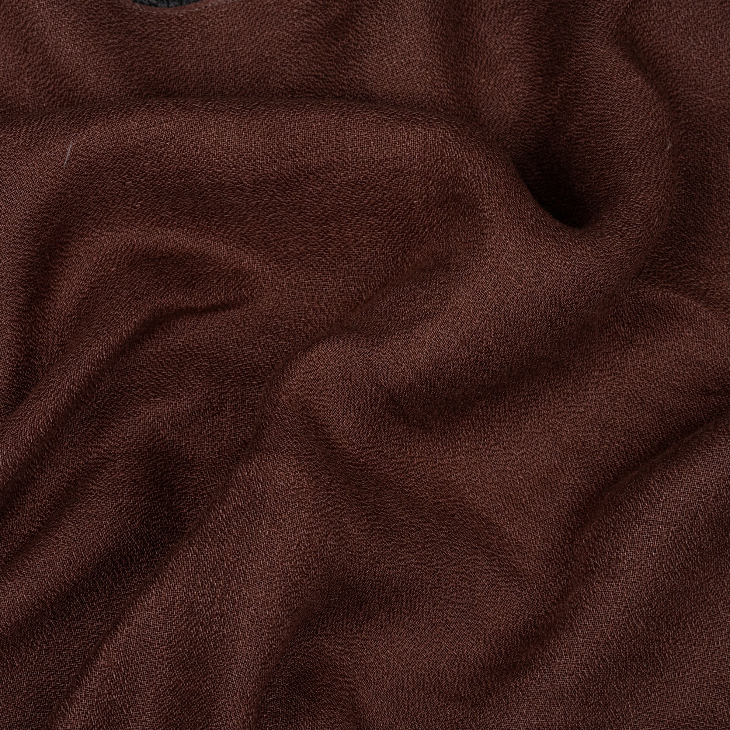 Wine red color fabric with visible sheen and subtle folds