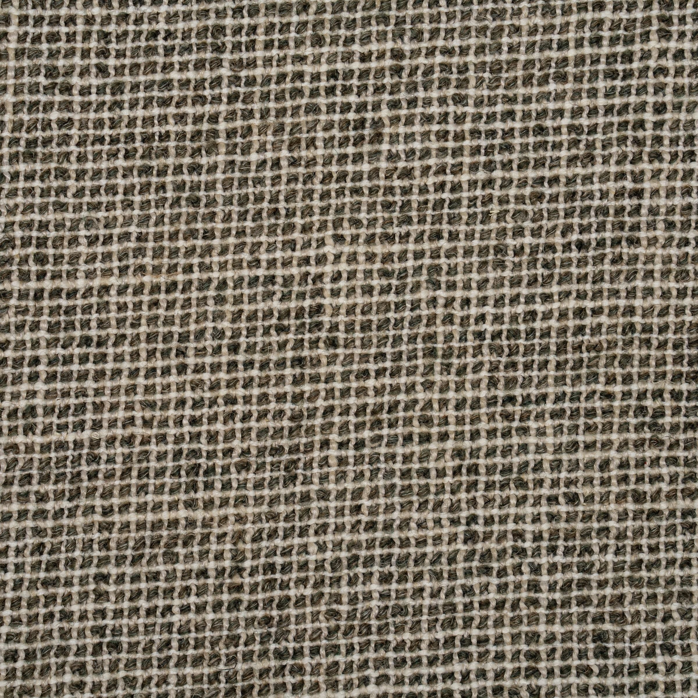 Fabric pattern with a grid-like structure in shades of green.