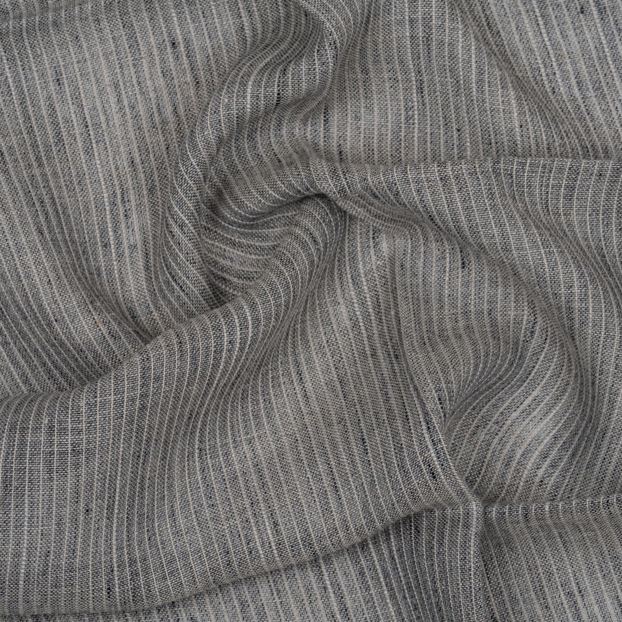 Hazy colored striped fabric with wavy folds