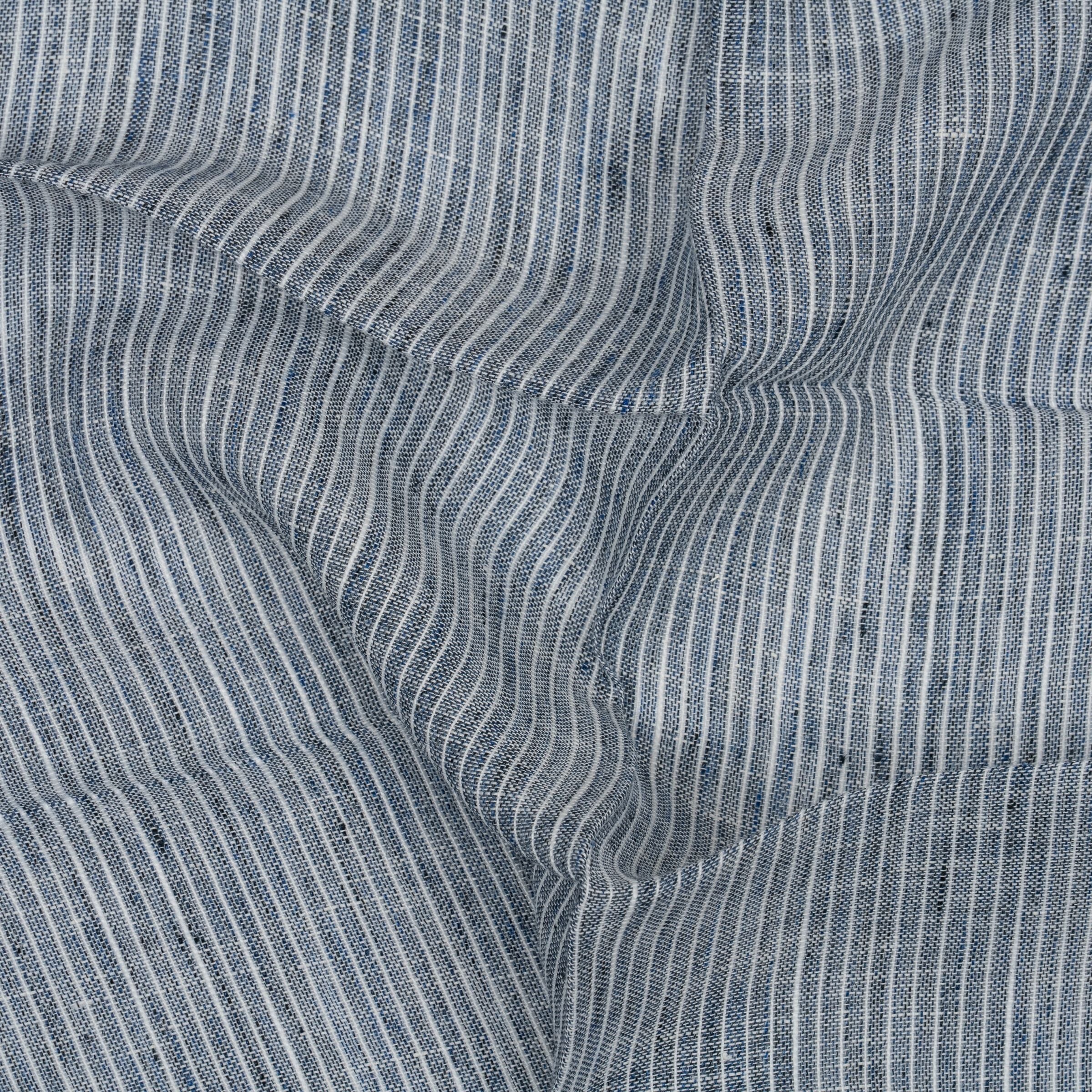 Close-up of blue fabric with white stripes and subtle folds