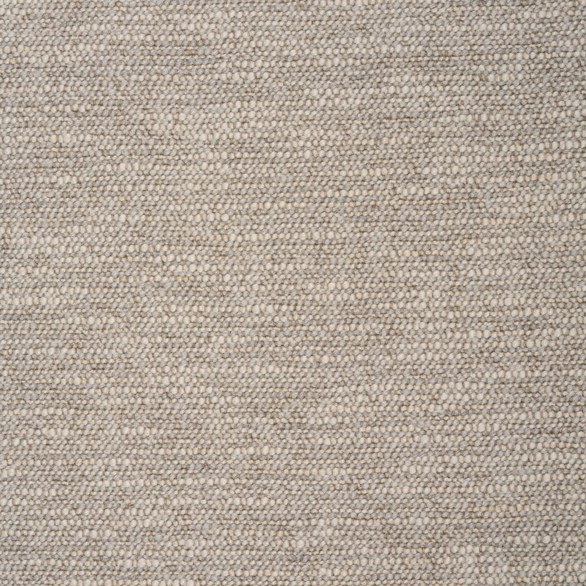 Zoomed out view of textured stone colored upholstery