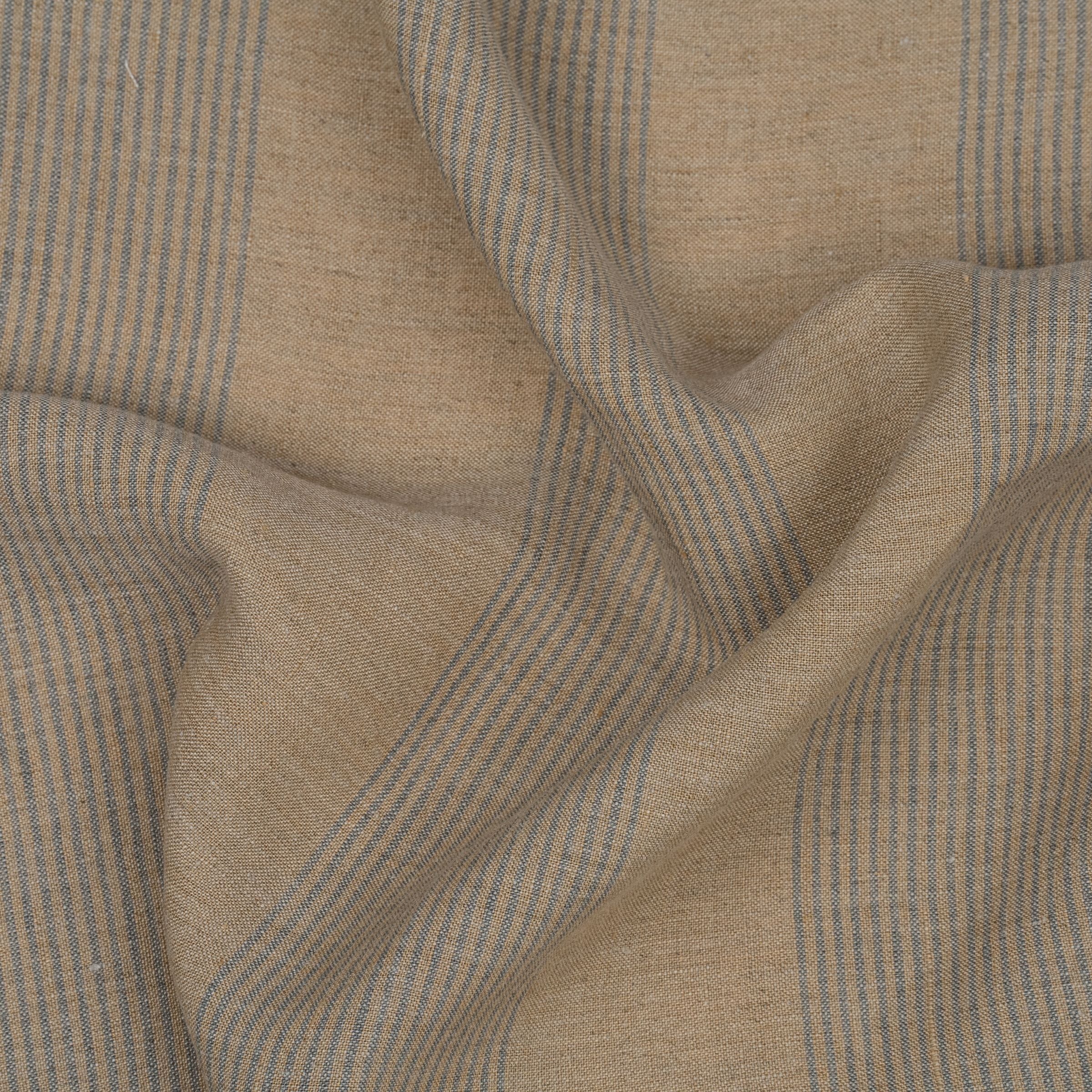 Light brown fabric with navy blue pinstripes and subtle folds
