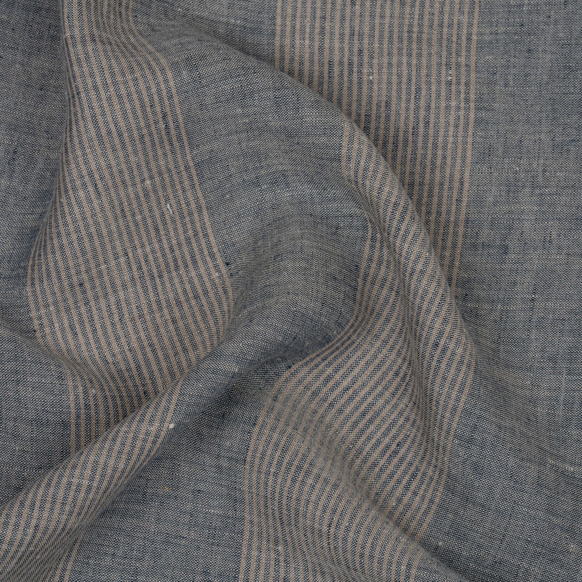 Blue fabric with beige stripes and subtle folds