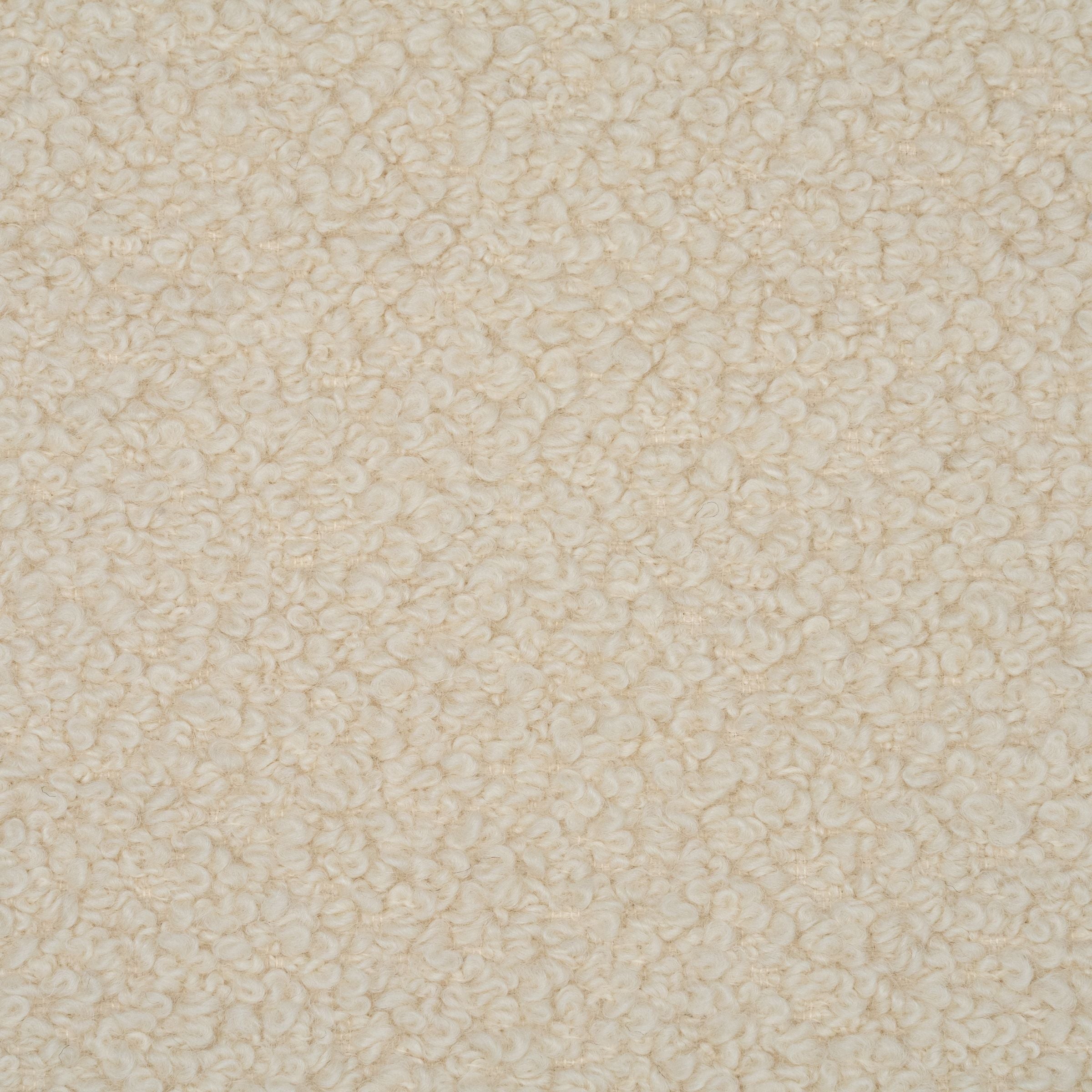 Close up of boucle upholstery in a cream color