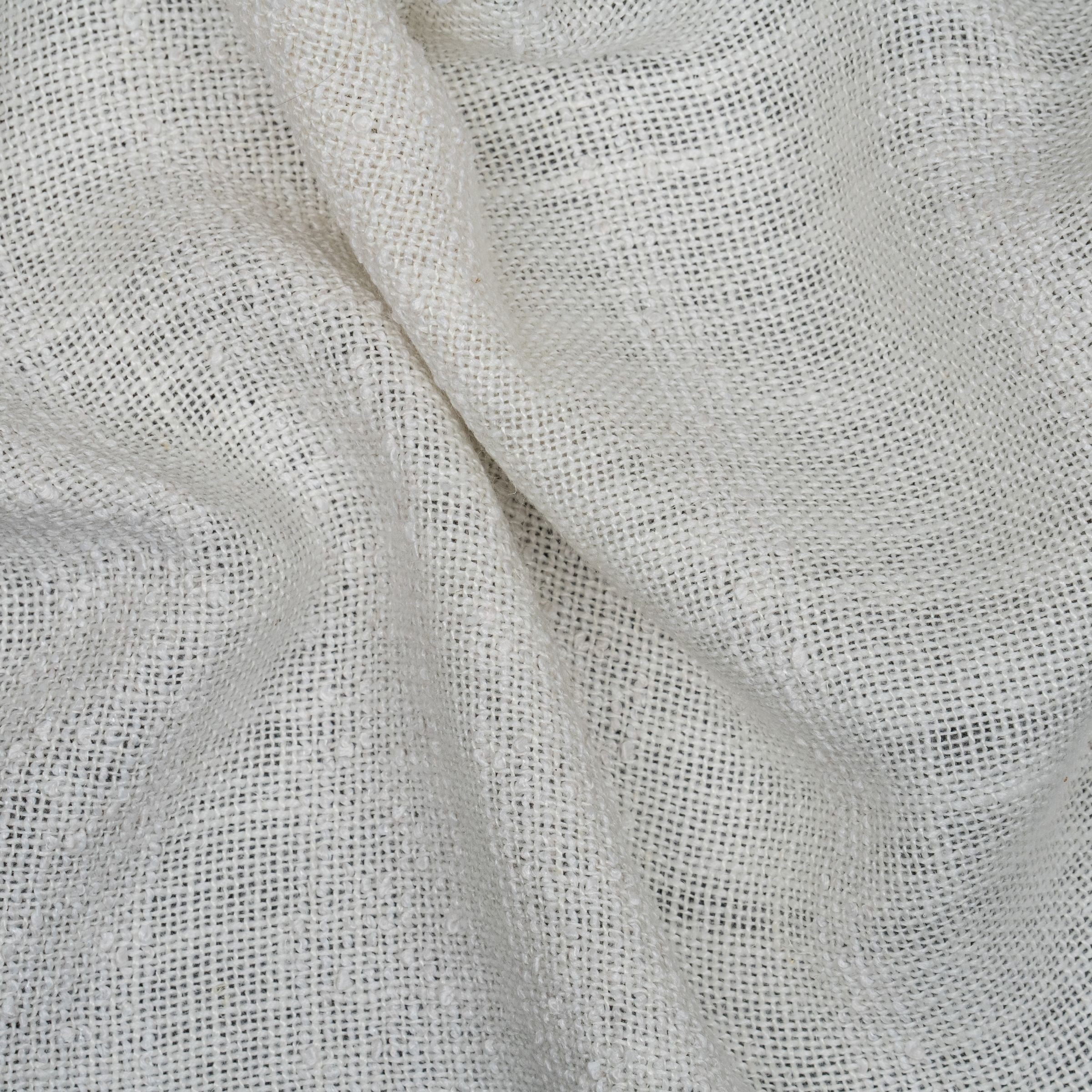 White fabric with white textured stripes and wavy folds