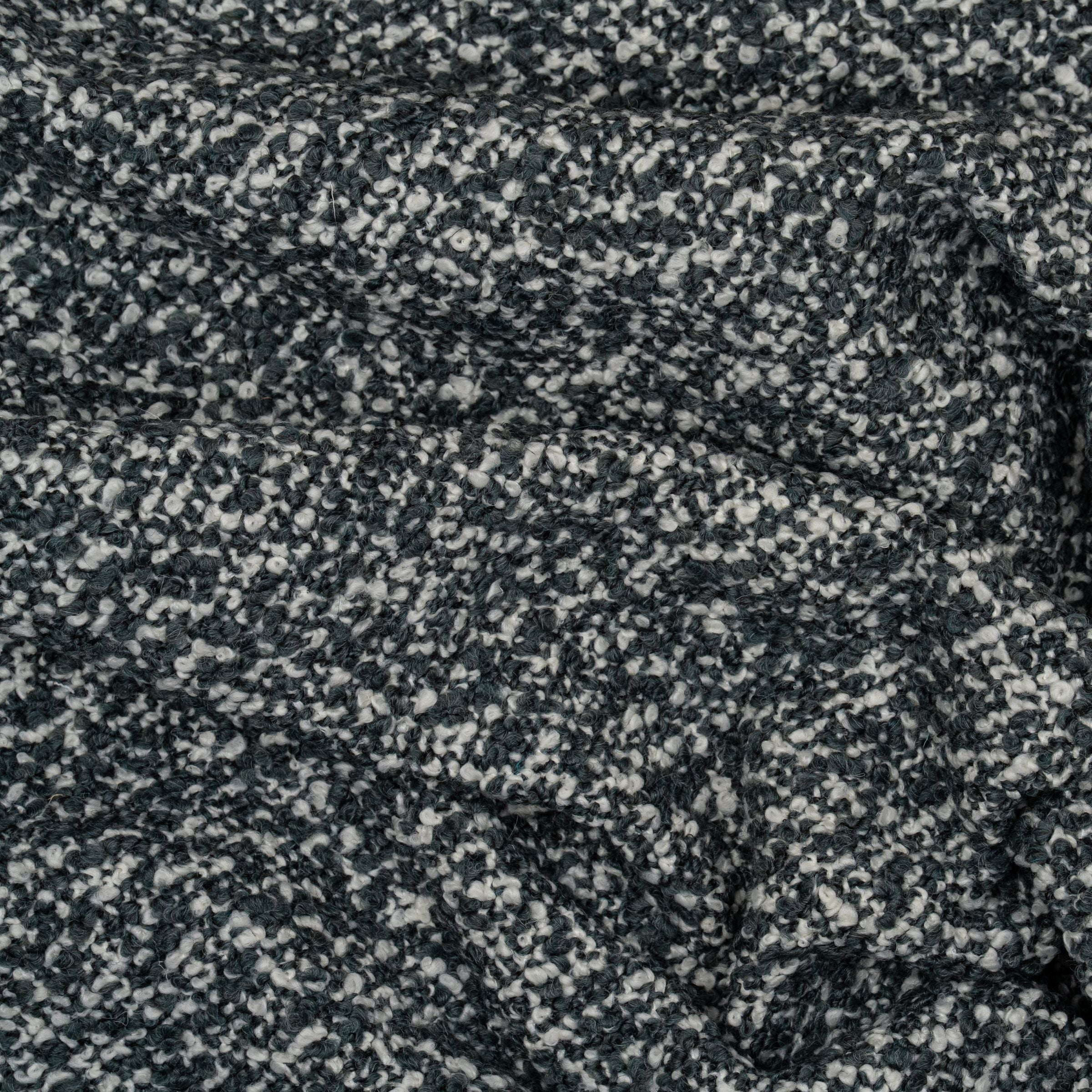 Boucle upholstery with a pattern of white and light blue colors