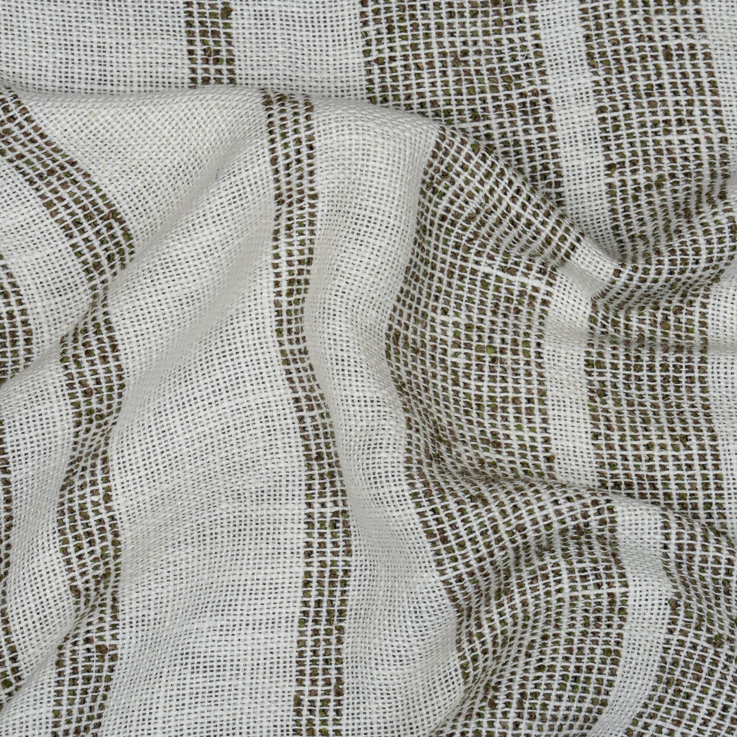 White fabric with green textured stripes and wavy folds