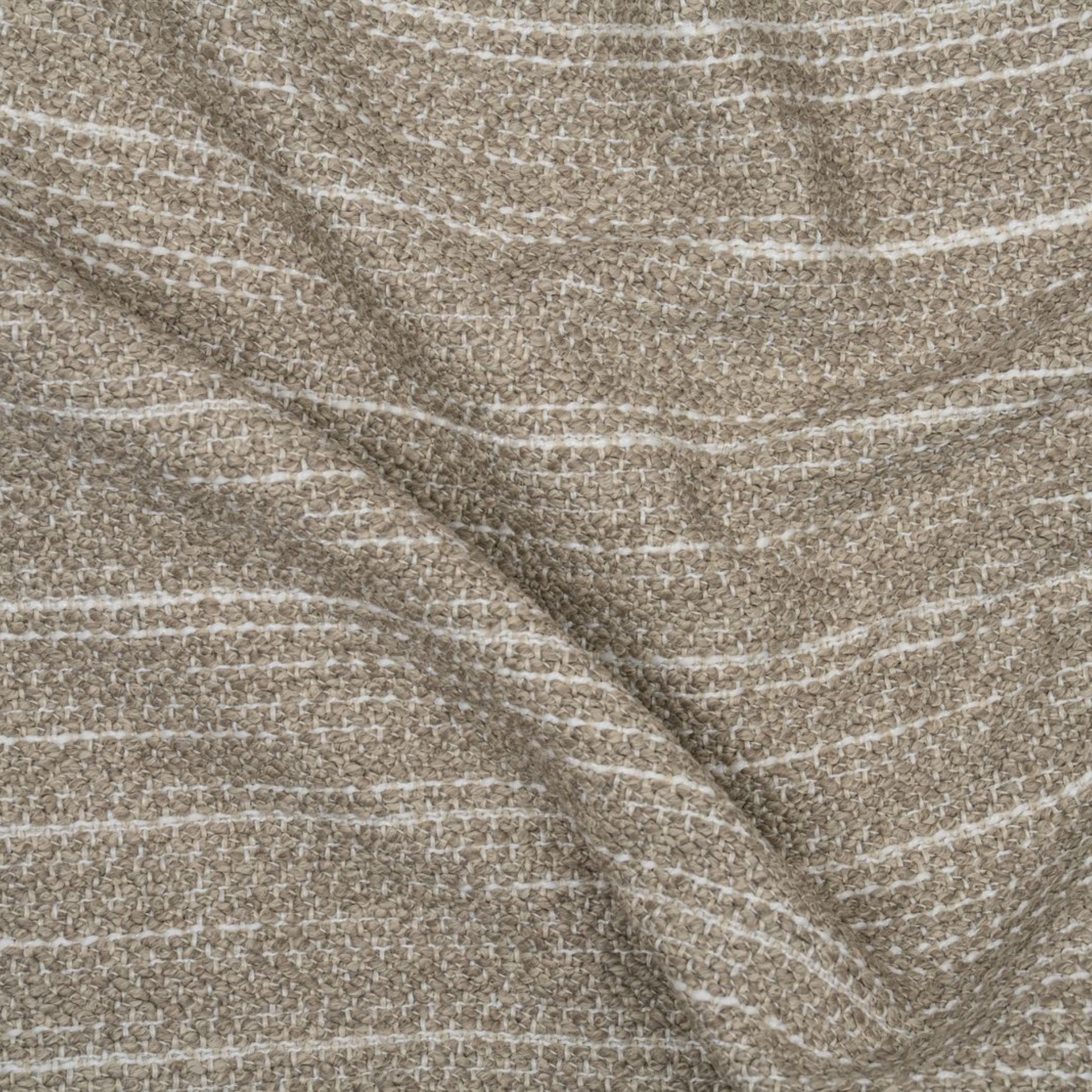 Textured gray and white upholstery with wavy folds