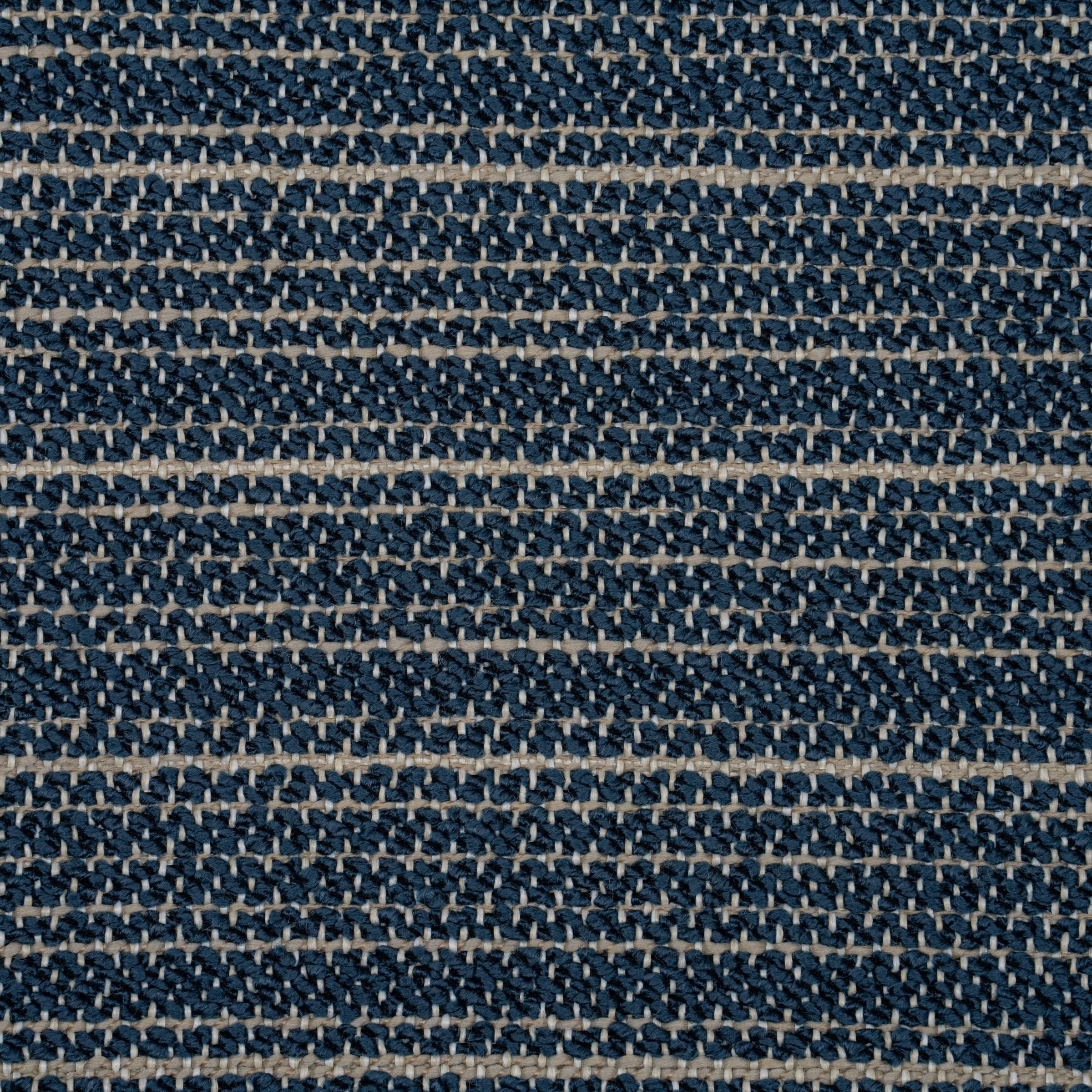 Close-up of a textured blue and beige upholstery pattern
