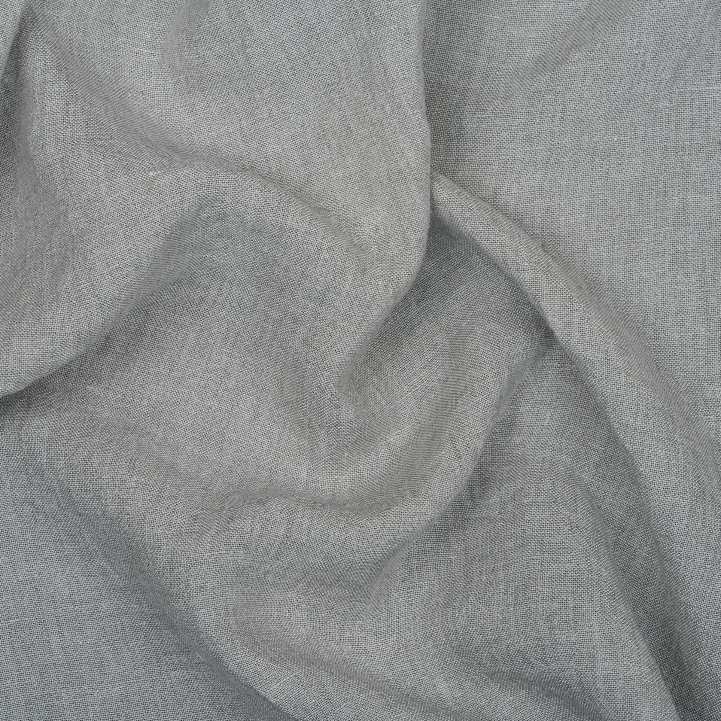 Light gray plain weave fabric with wavy folds