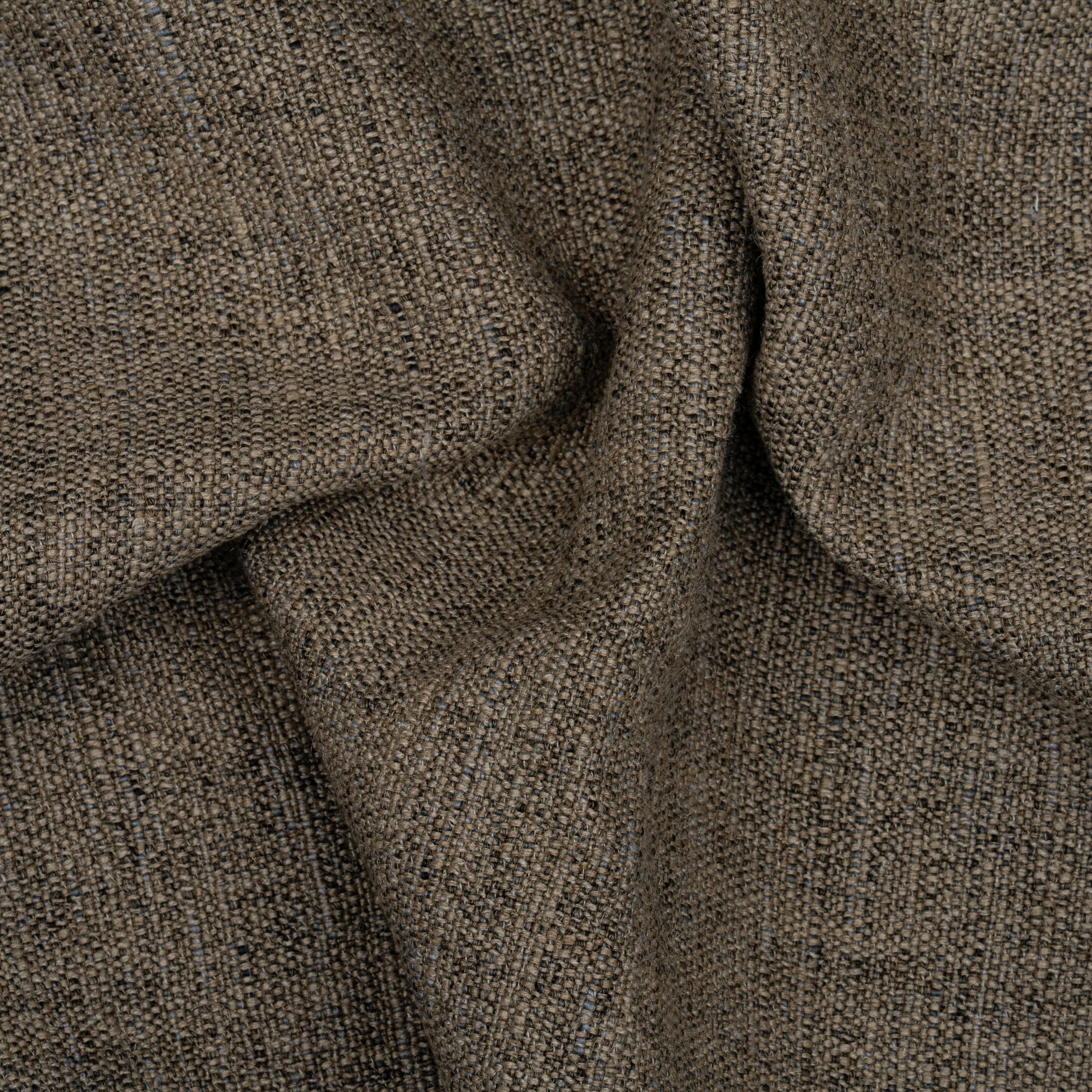 Brown textured fabric pattern with wavy folds