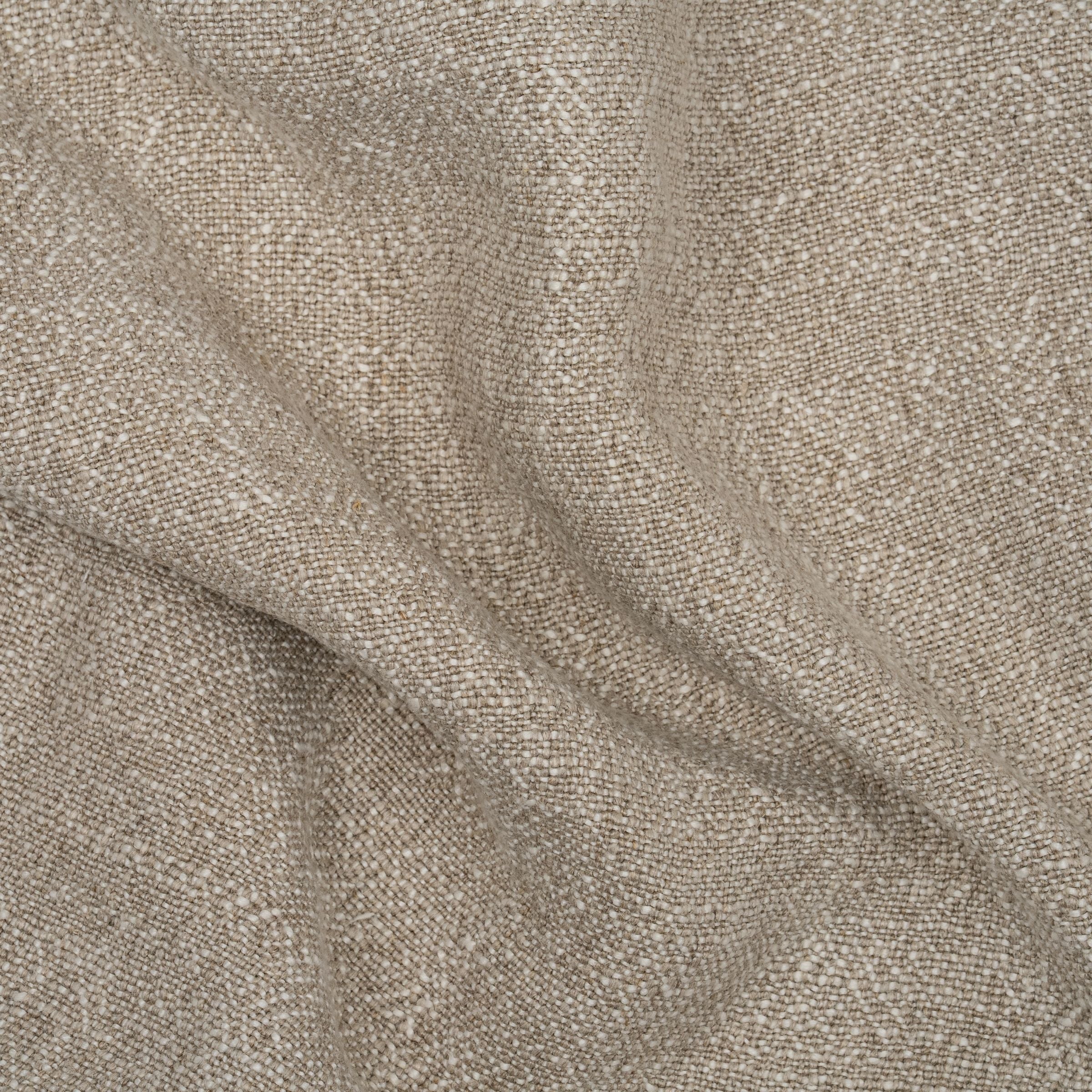 Oatmeal colored fabric with wavy folds
