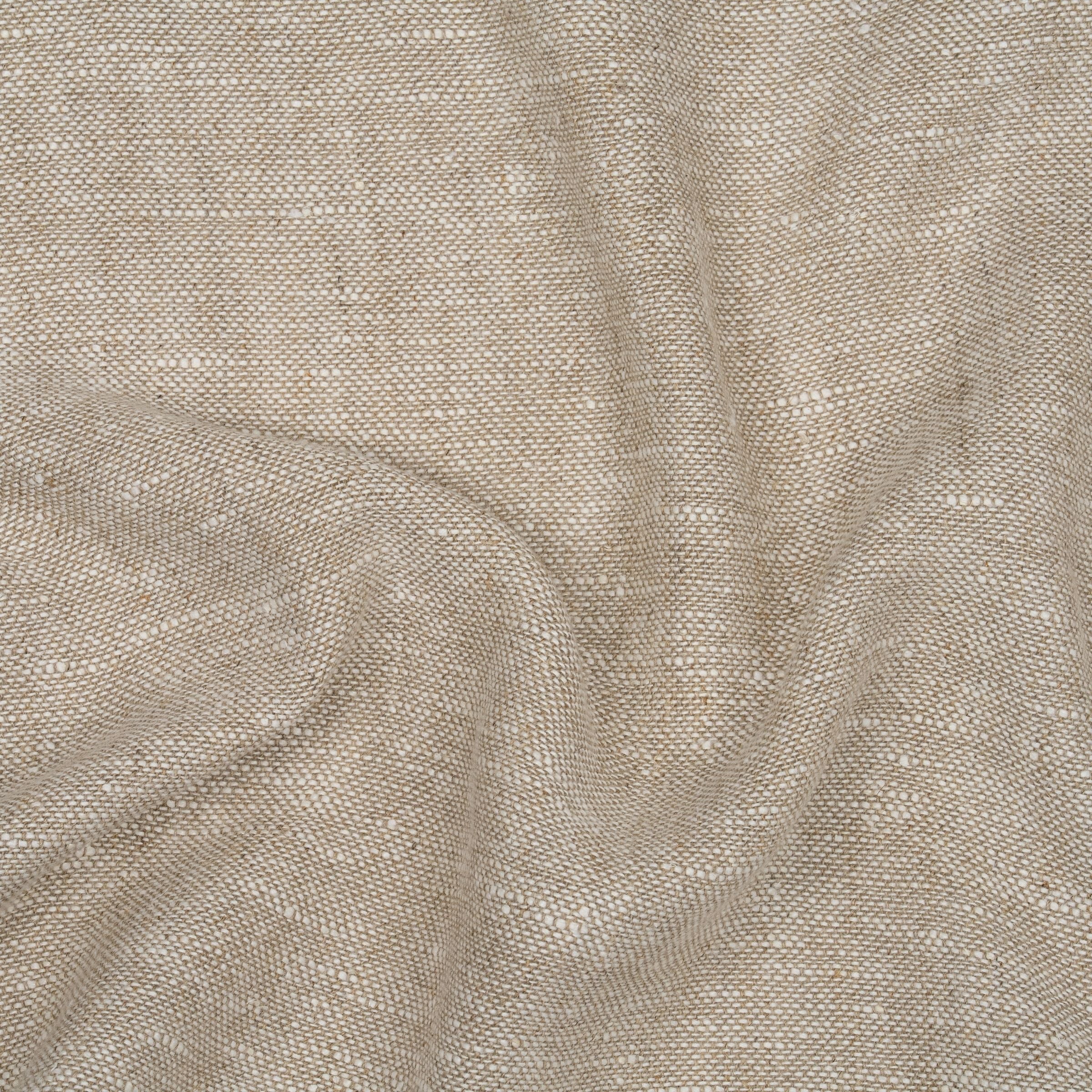 Close up of textured beige fabric with wavy folds