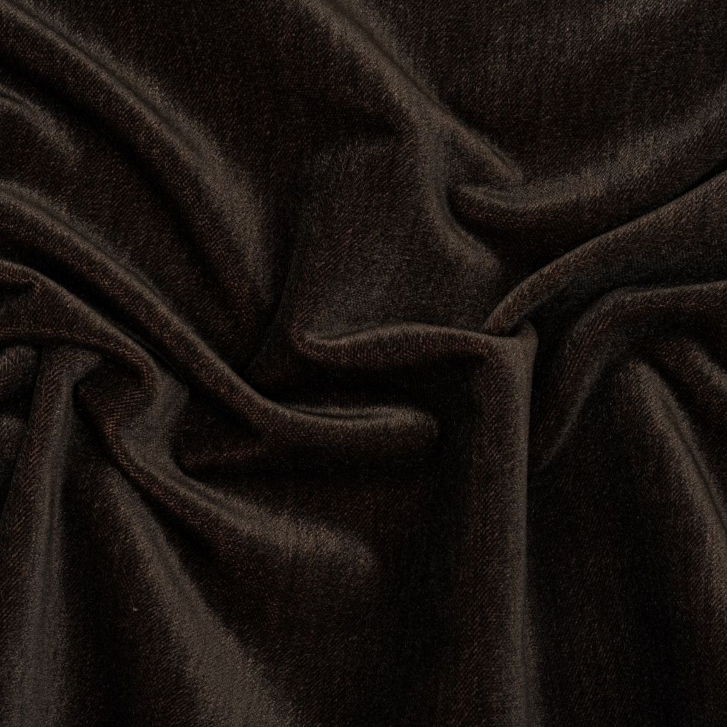 Close-up of dark brown fabric with folds