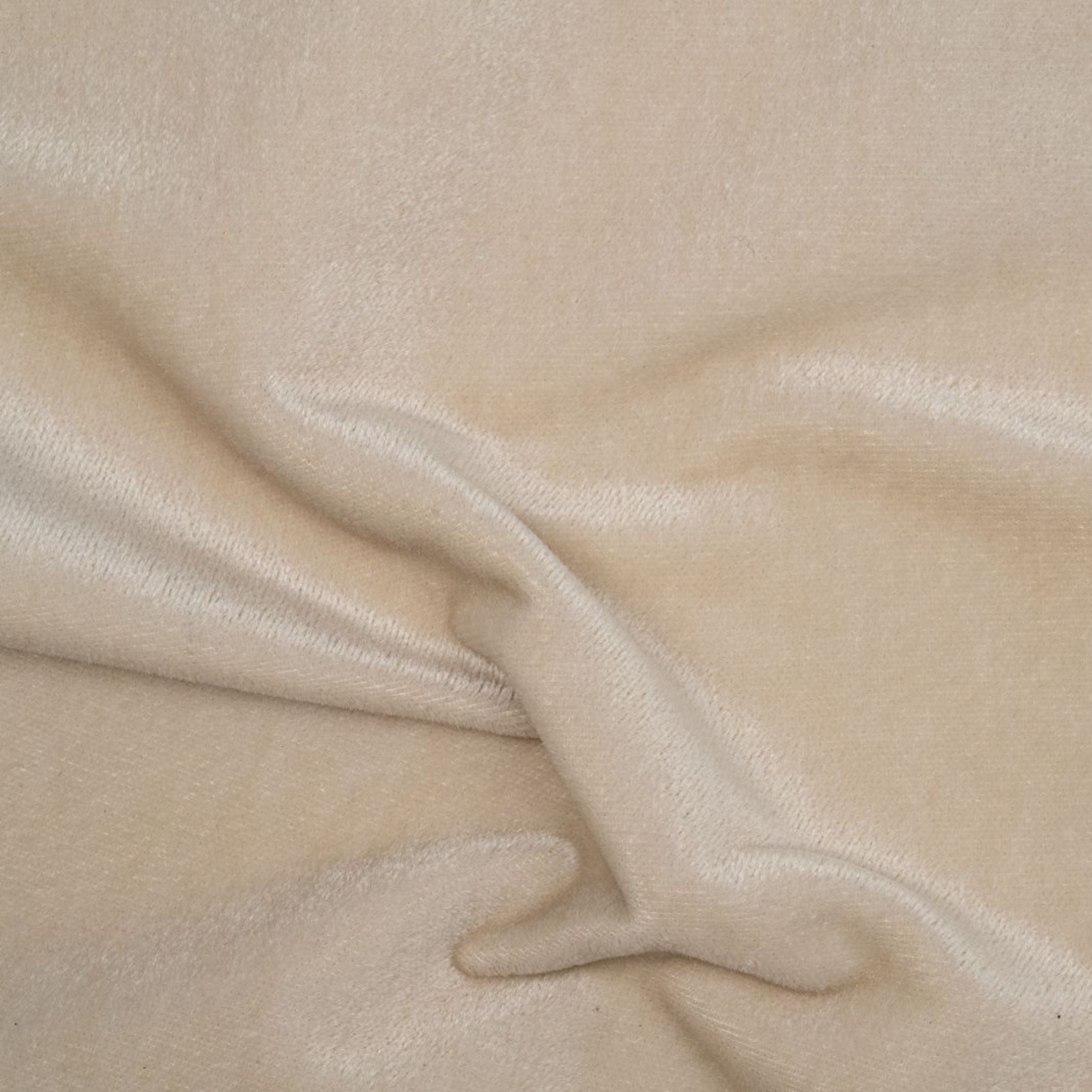 Close-up of beige fabric with a soft fold
