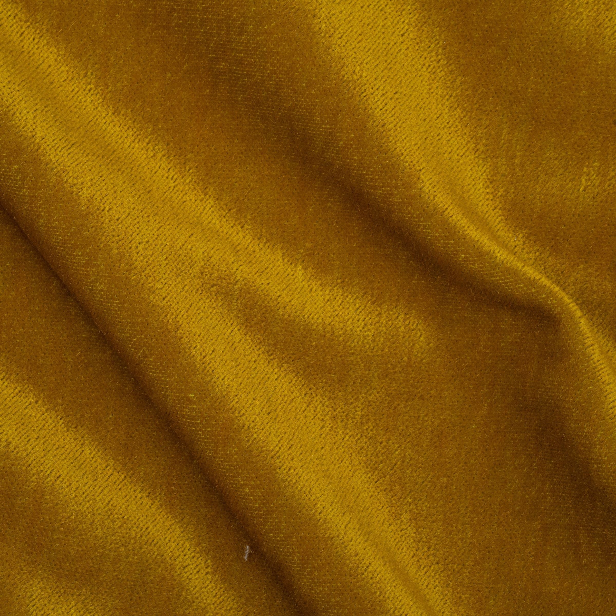 Close-up of yellow fabric with visible sheen and subtle folds
