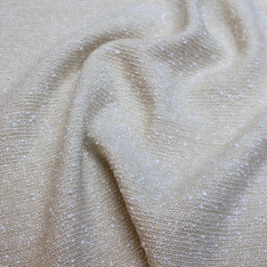Dark neutral beige fabric with small slub knots of light gray fabric woven underneith.