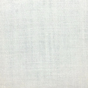 Linen fabric with bold colored threads creating a white monochromatic slub textured textile.