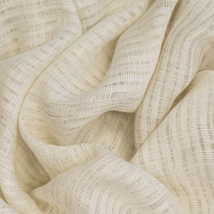 Close-up of off-white textured fabric with wavy folds
