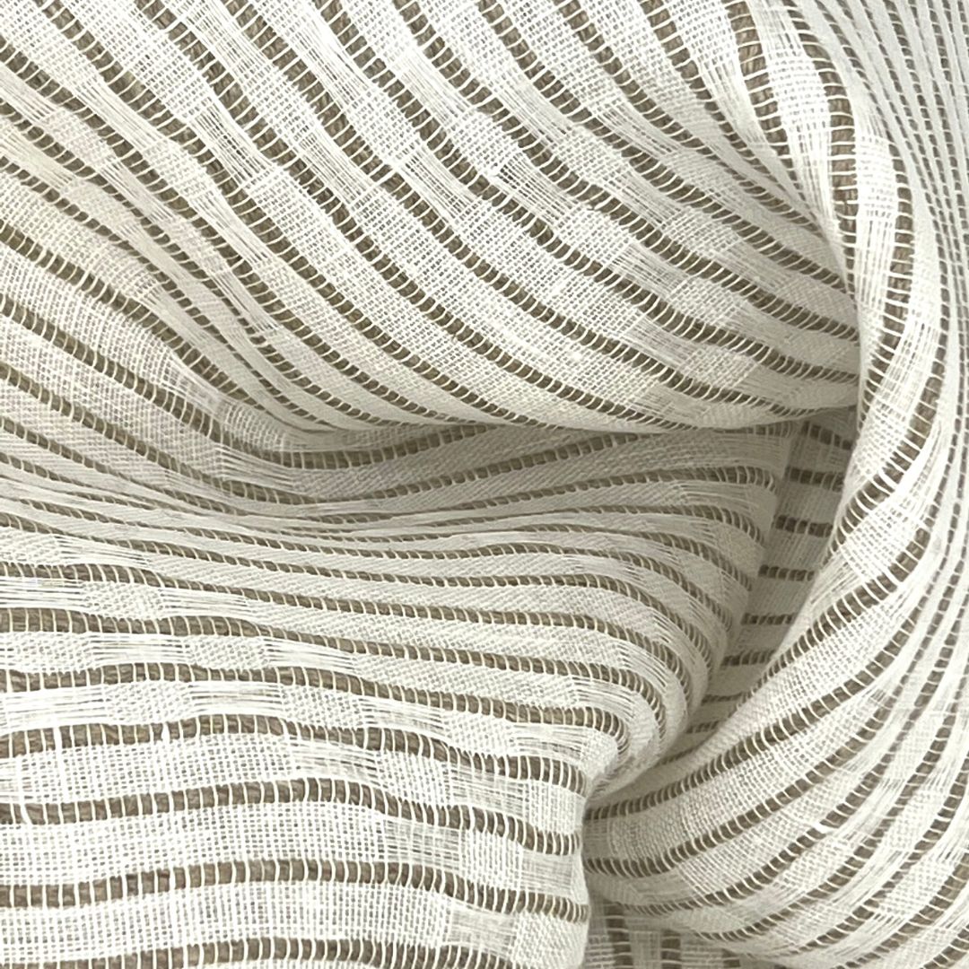 Close-up of striped fabric with circular wavy pattern