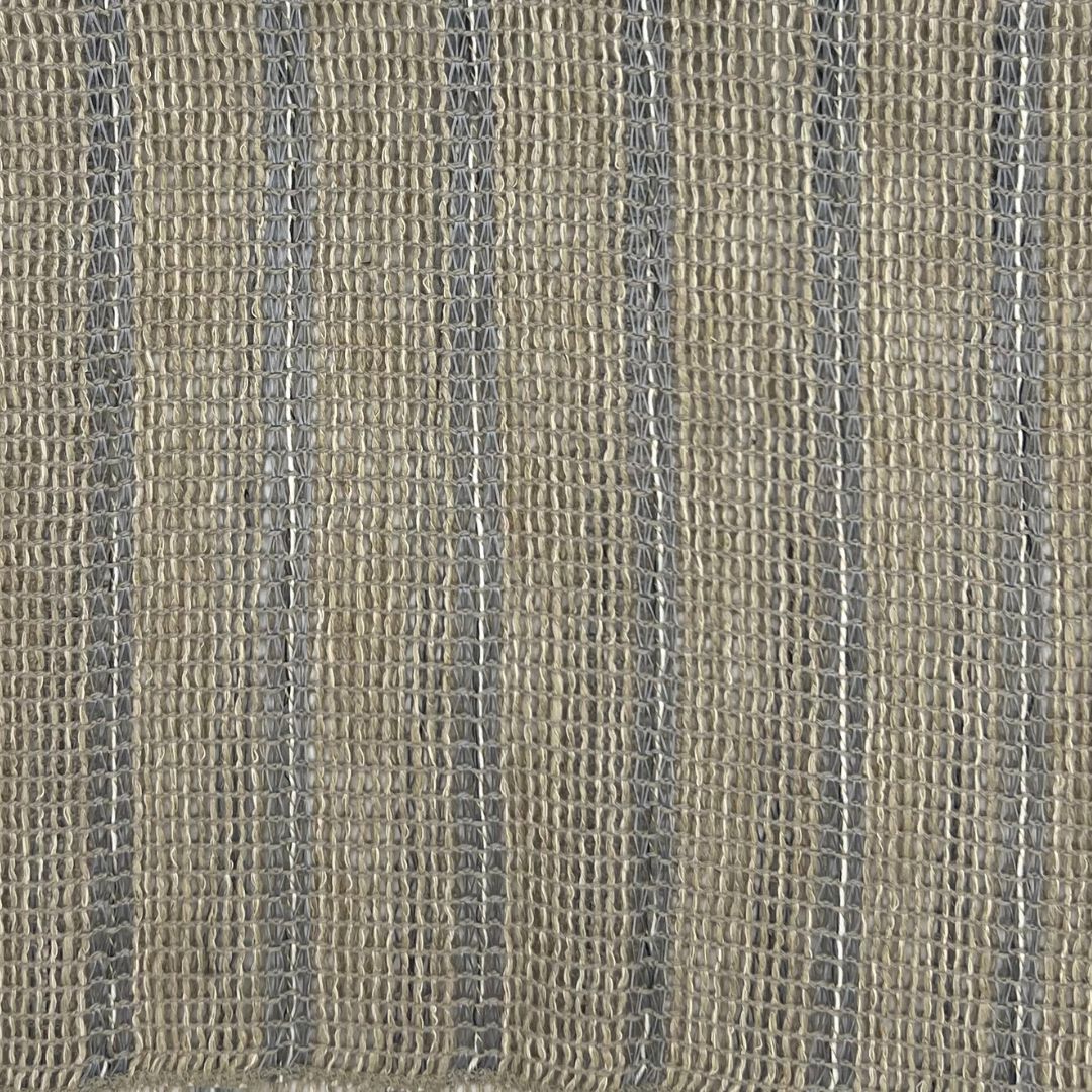Loose weave in a natural color with a subtle vertical stripe pattern.