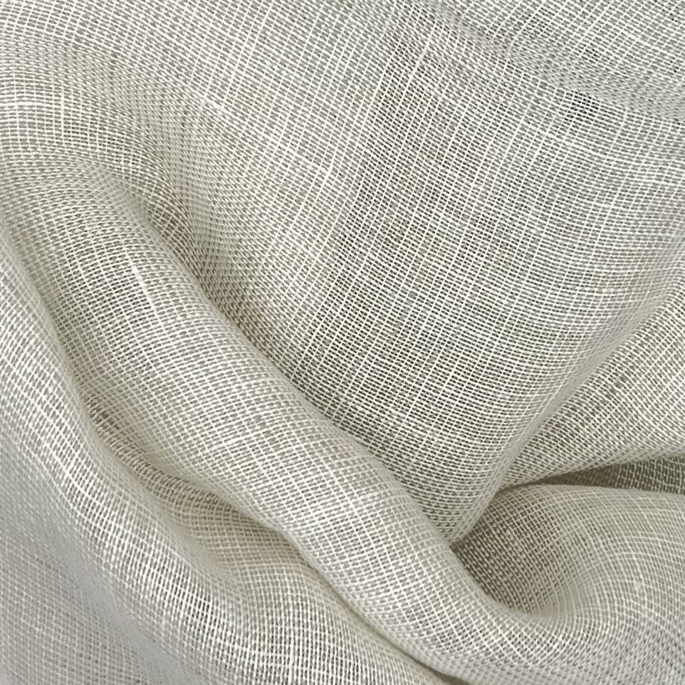 Close-up of textured beige fabric with a subtle pattern