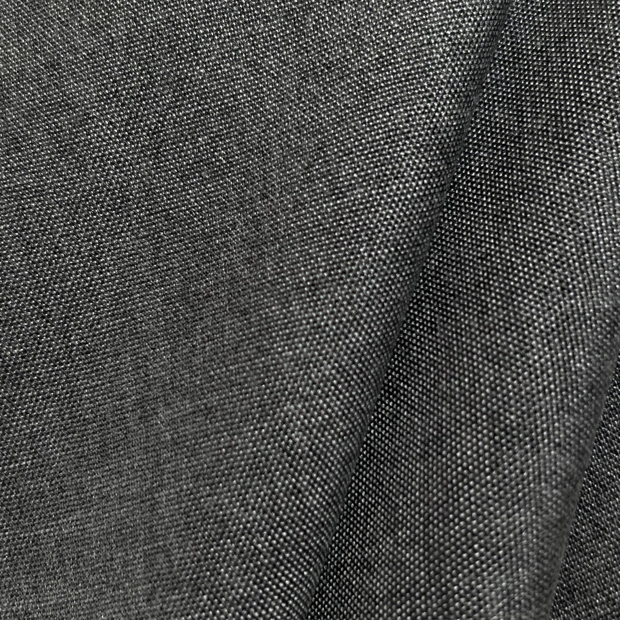 Close-up of textured dark gray fabric with a large fold