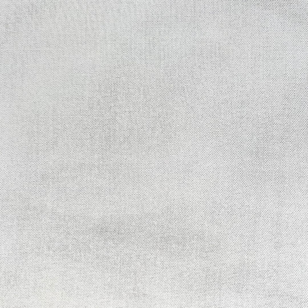 Pure white fabric exhibiting an exceptionally fine, consistent weave with minimal visible texture.