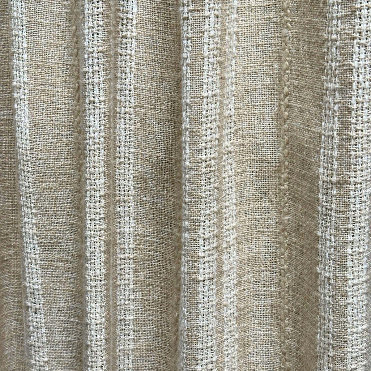 Glasgow is a rough-textured beige fabric with a white striped with a visable weave.