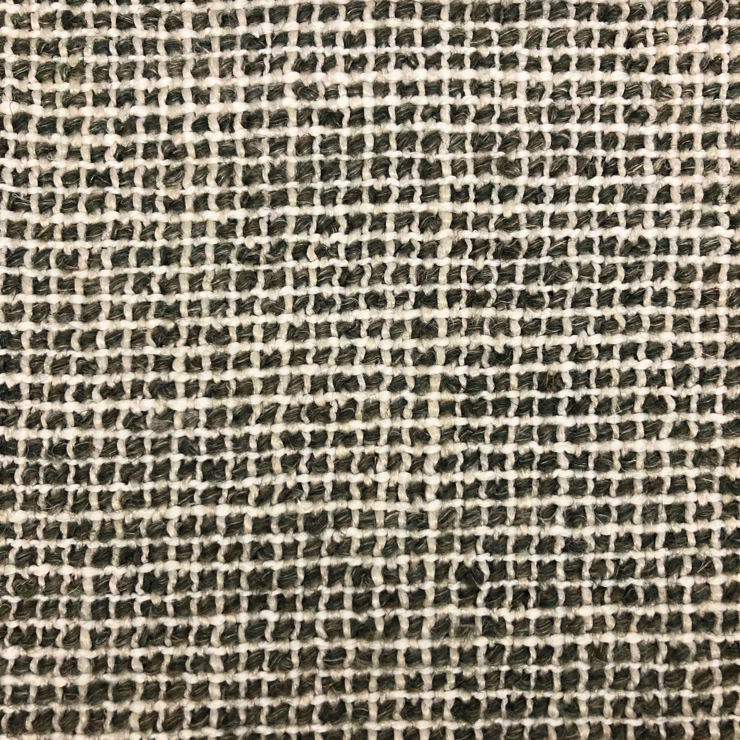 A fuzzy tactile weave with moss green and off-white threads.