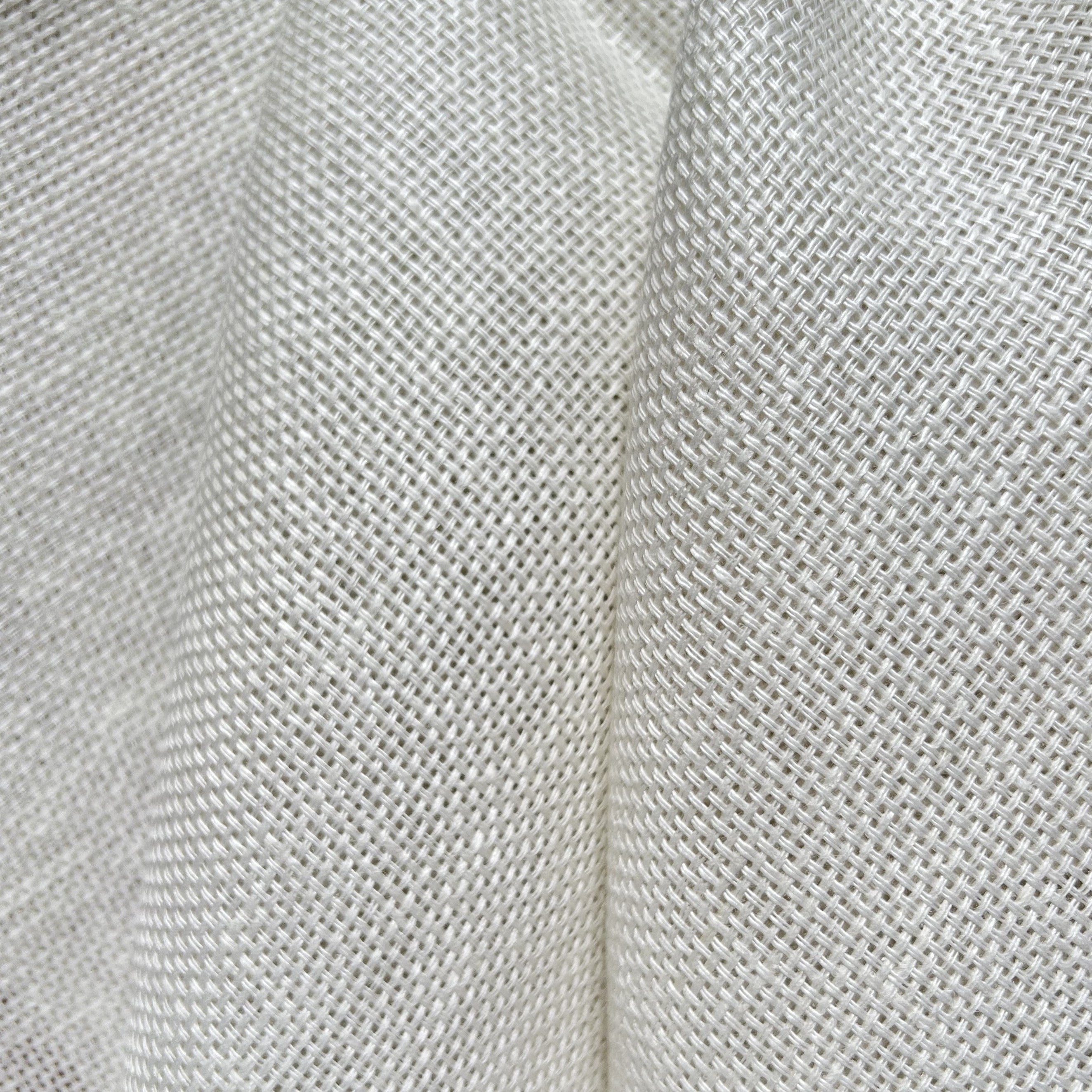 Canvas white linen fabric with a loose weave and large fold down the middle