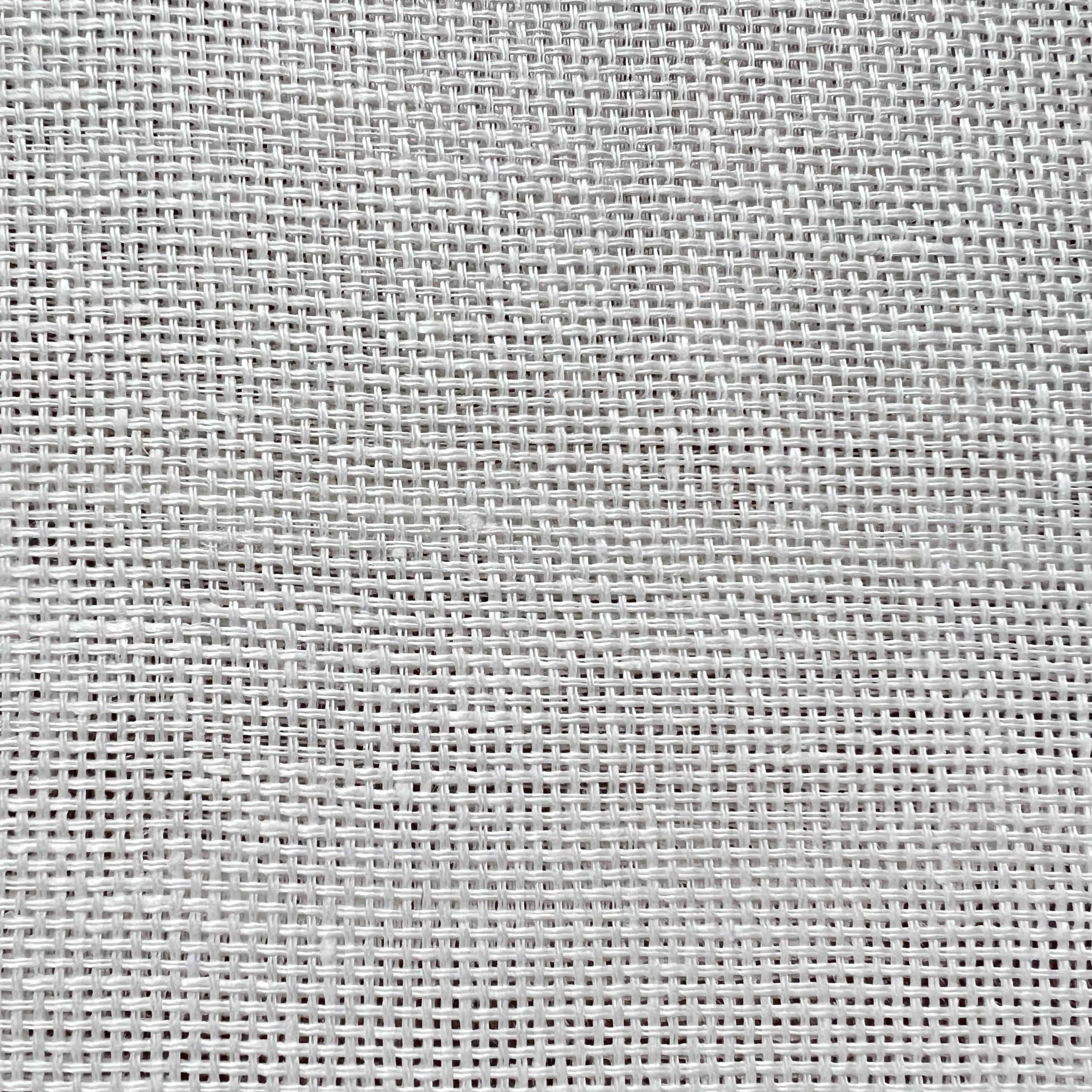Pure white linen fabric with a artificial weave, and gaps in the textile for light filtration.