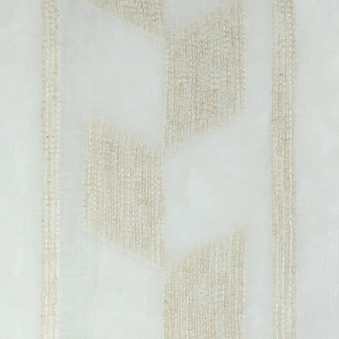 Lancy is a sheer white window covering fabric with a subtle natural colored rasied geometric pattern. 