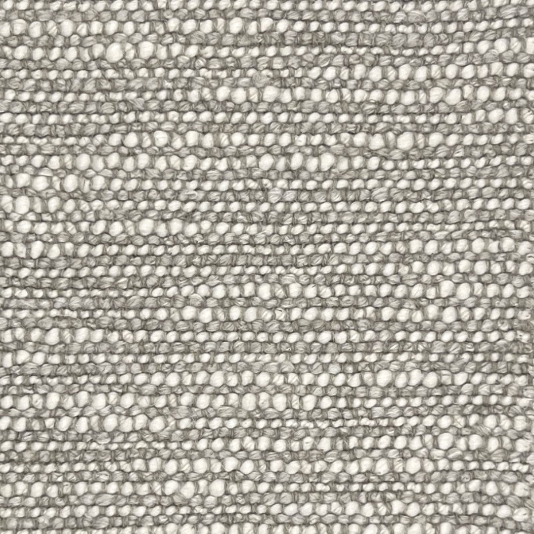 Lecce a textured upholstery in beige with a pronounced looped weave, giving it a chuncky appearance. 