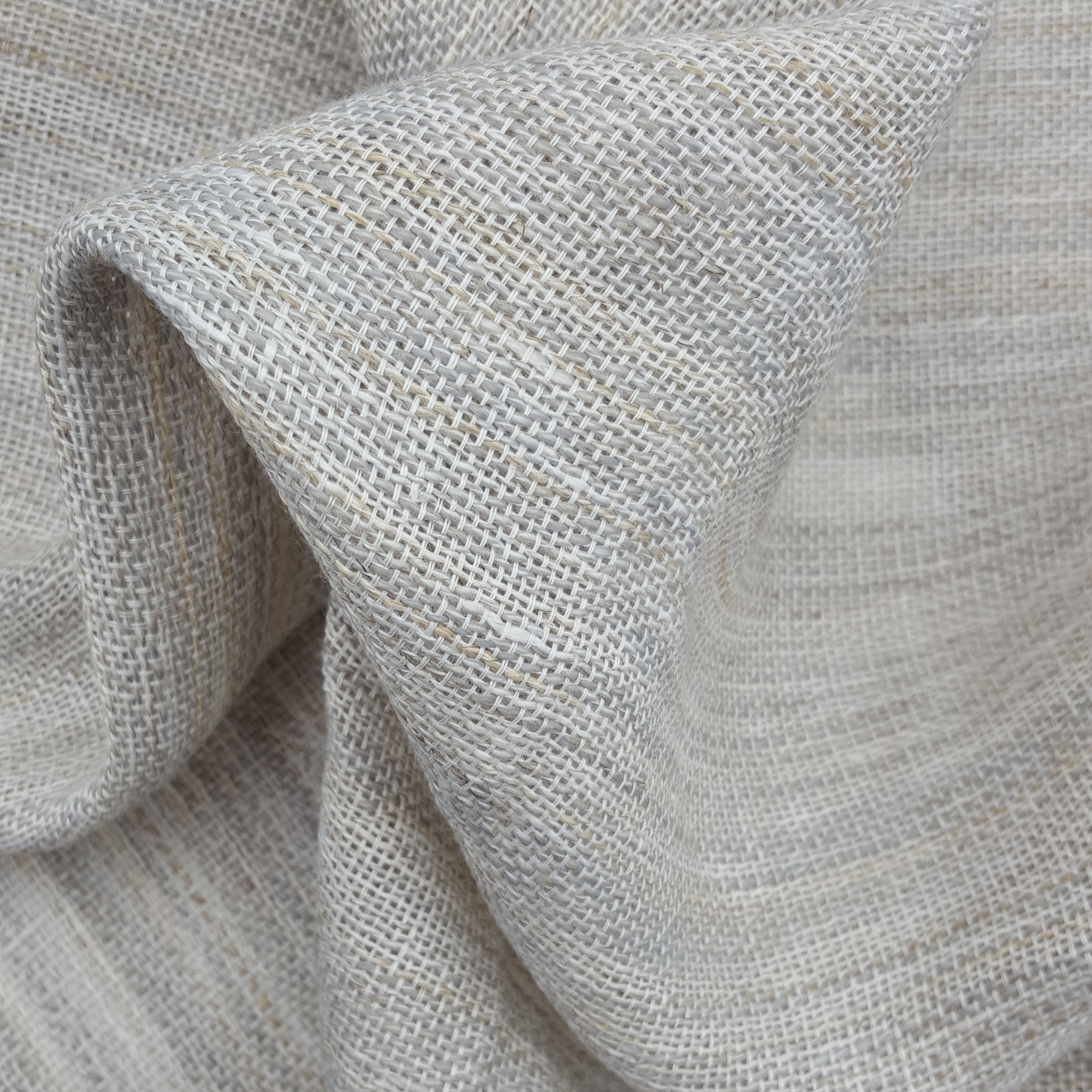 Close-up of textured gray fabric with folds