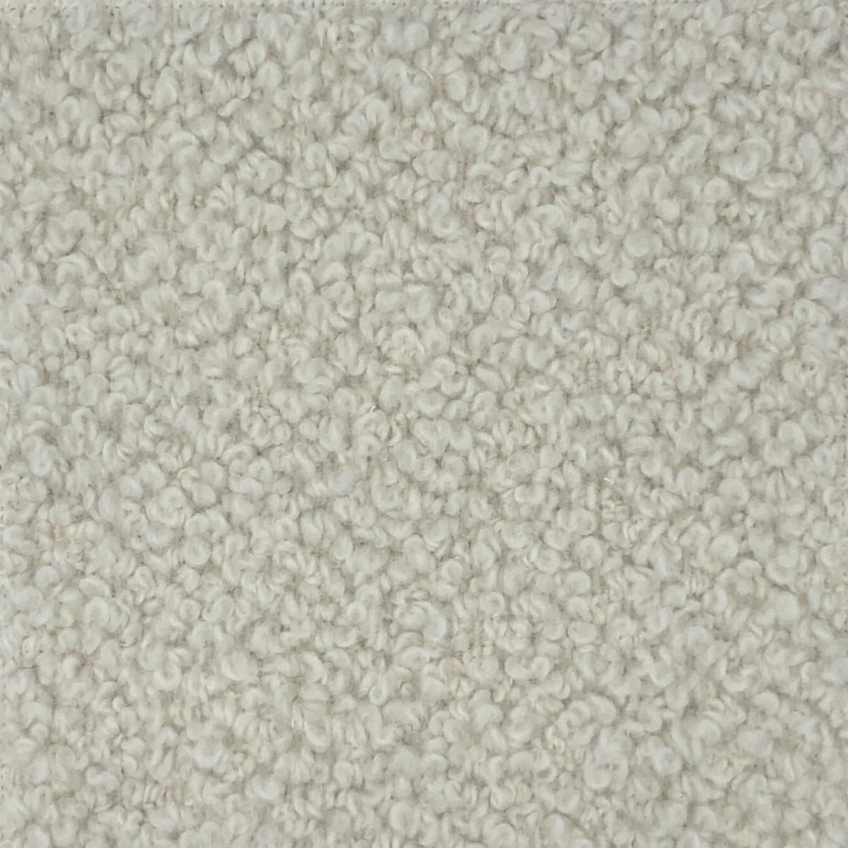 Lucca is a cream colored upholstery showcasing its dense looped pile and soft texture, creating versatile furnishing.