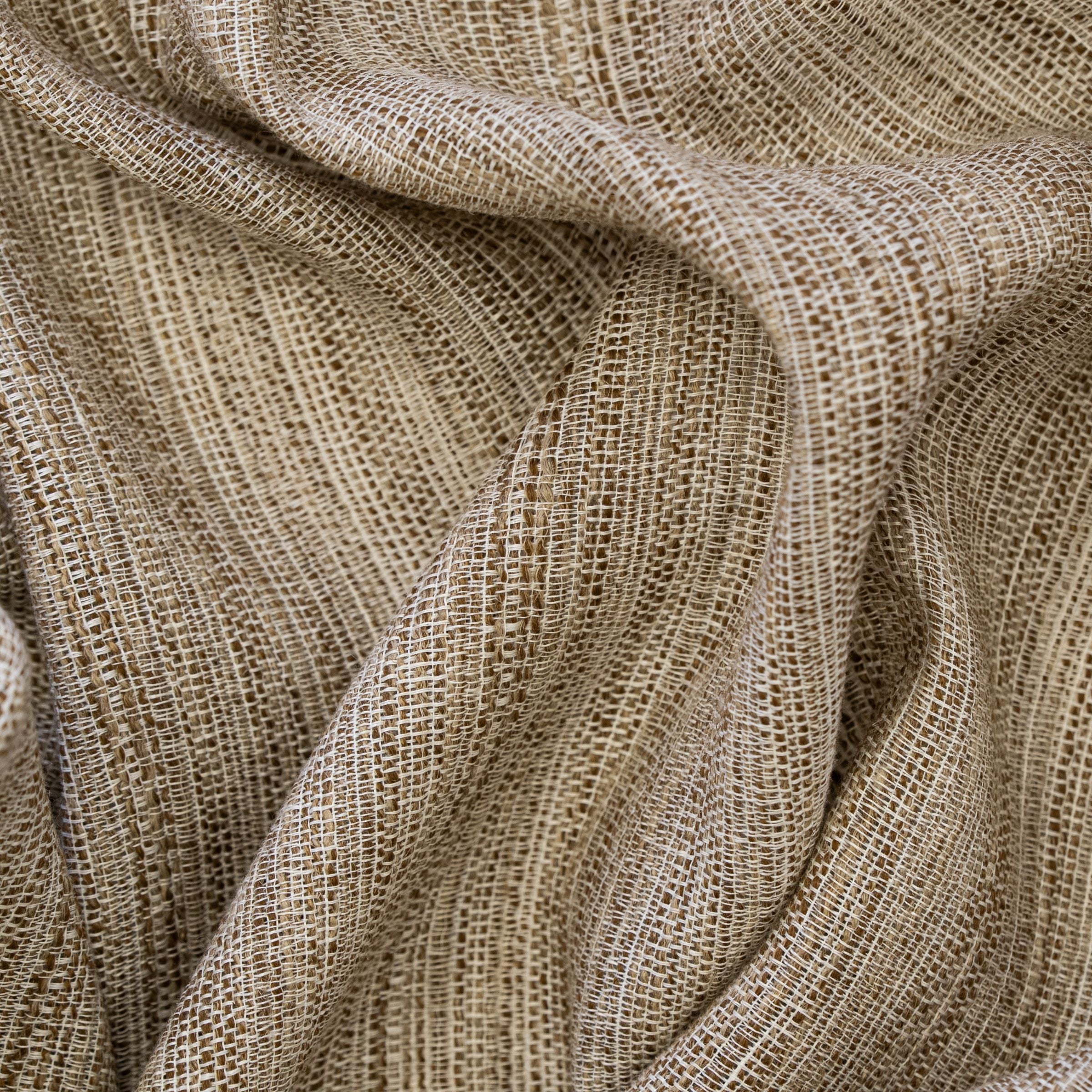 Textured beige and white fabric pattern with a wavy fold