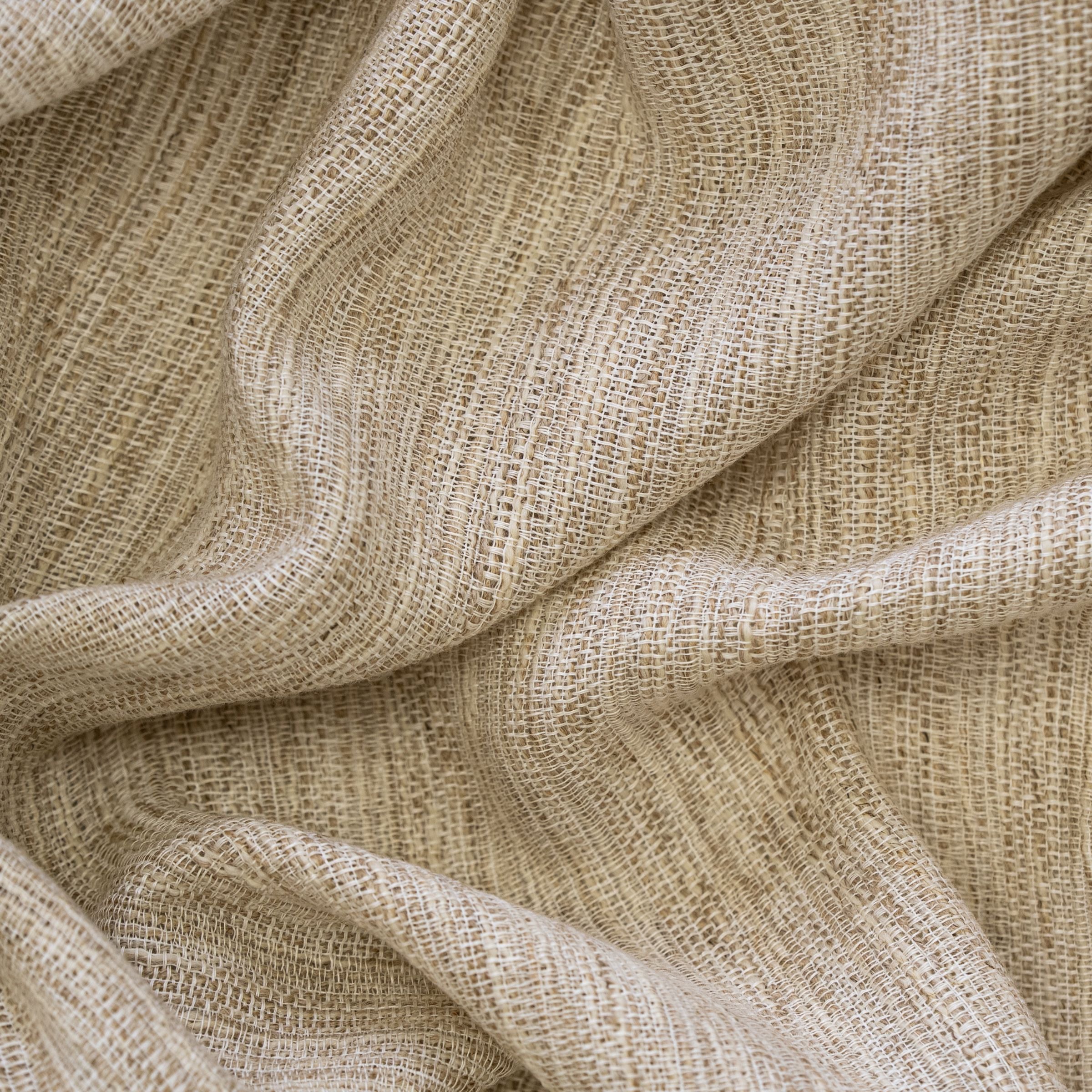 Beige and white fabric texture with large folds