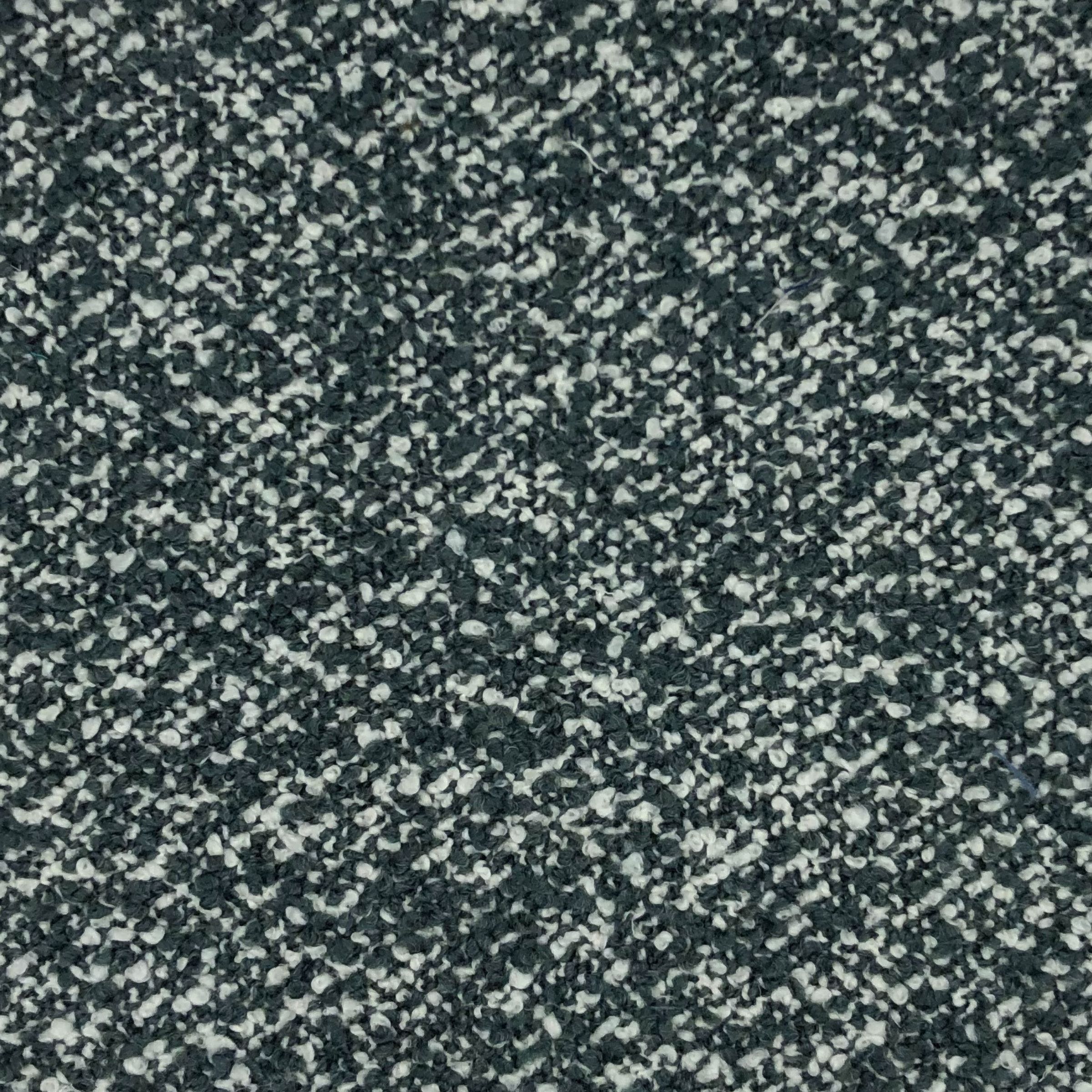 Maira - Mist is a highly textured, pebbled surface creating a contrast of soft fuzzy misty blue and white fibers. 